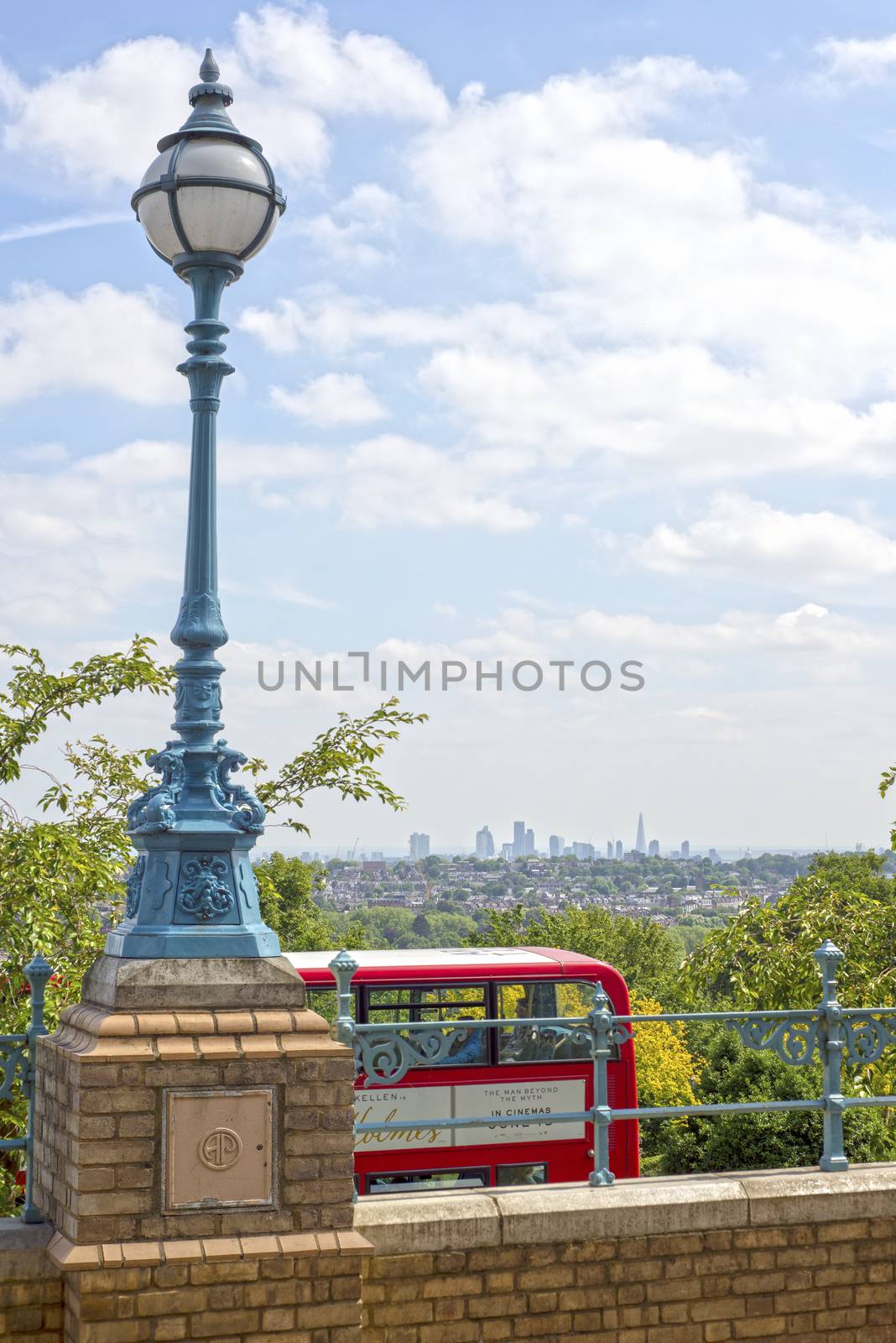 antique street light and red london bus by morrbyte