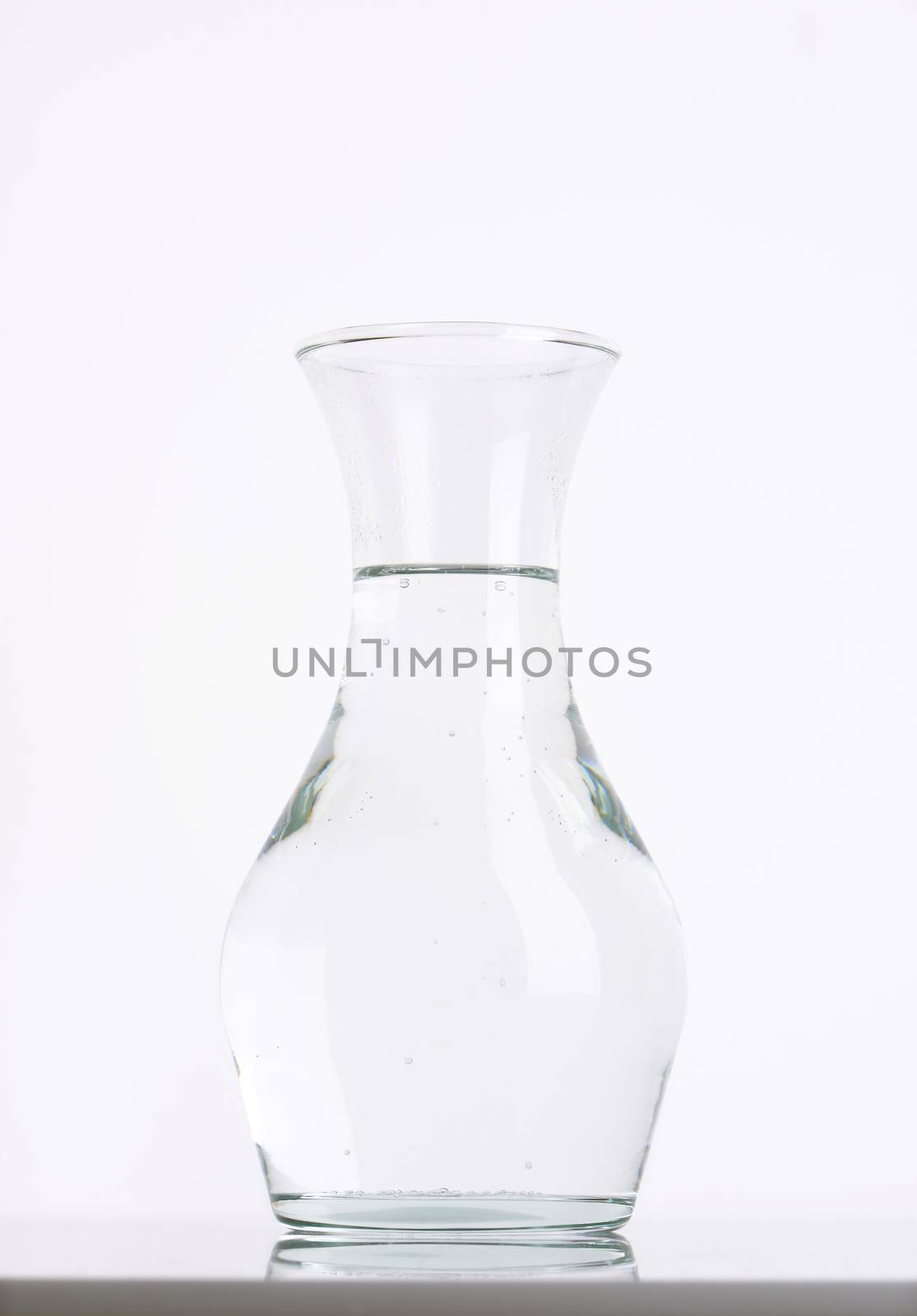 carafe of fresh water on white background