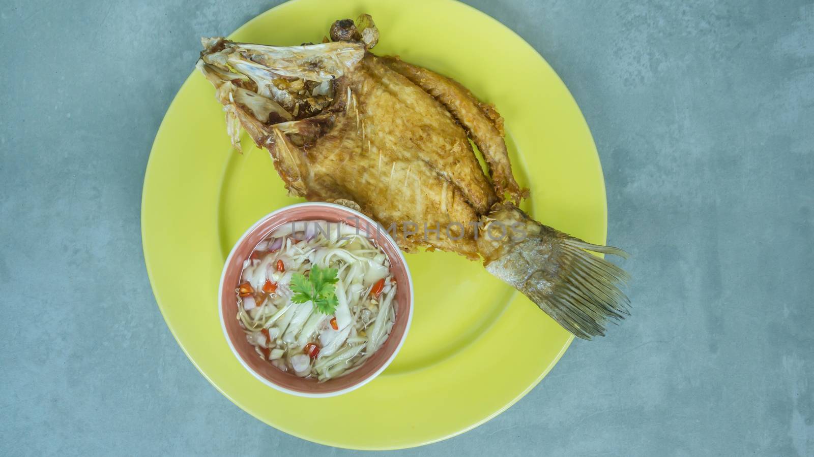 Deep fried fish with green mango salad