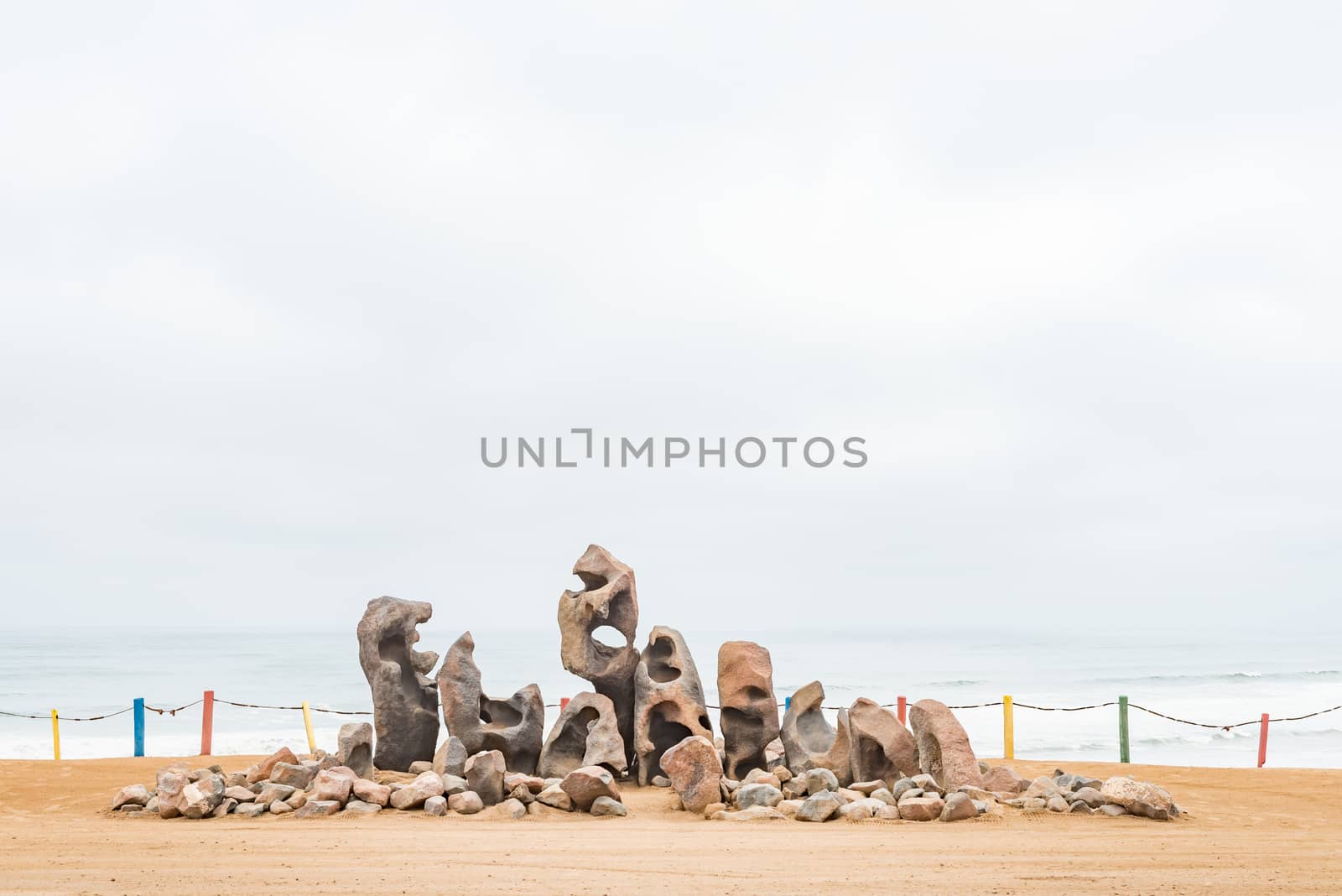 A display of weathered rocks on a dune in Henties Bay, a holiday town on the Skeleton Coast of Namibia
