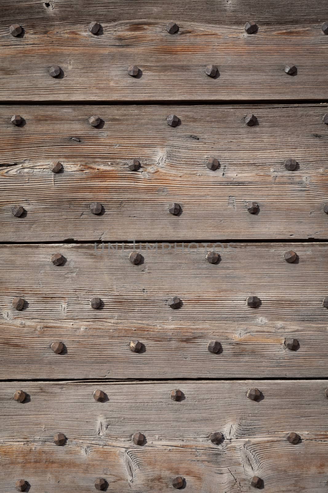Detail of a 200 years old Italian door, made of wood.  Background use.