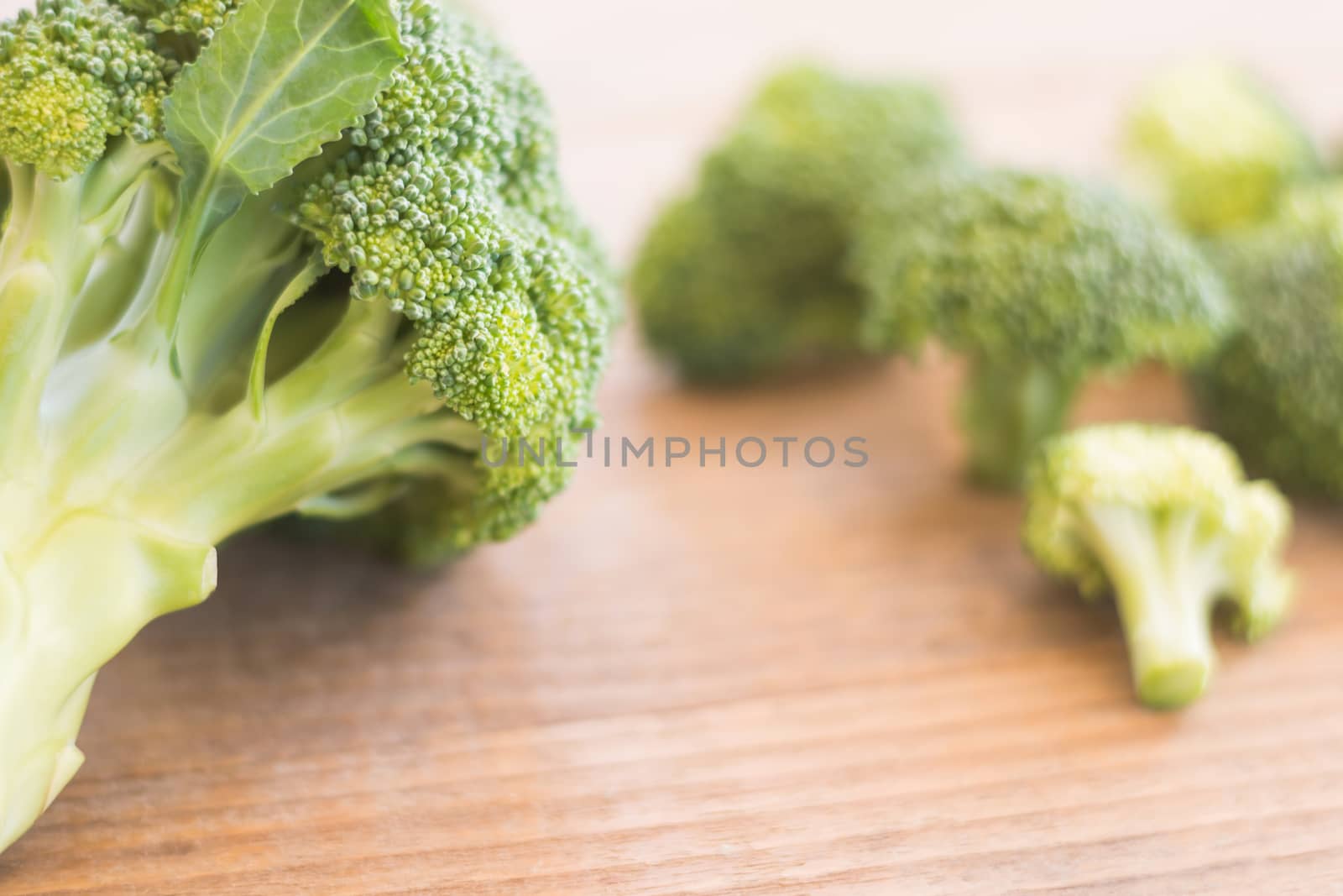 Fresh broccoli over rustic wooden background - healthy or vegeta by rakoptonLPN