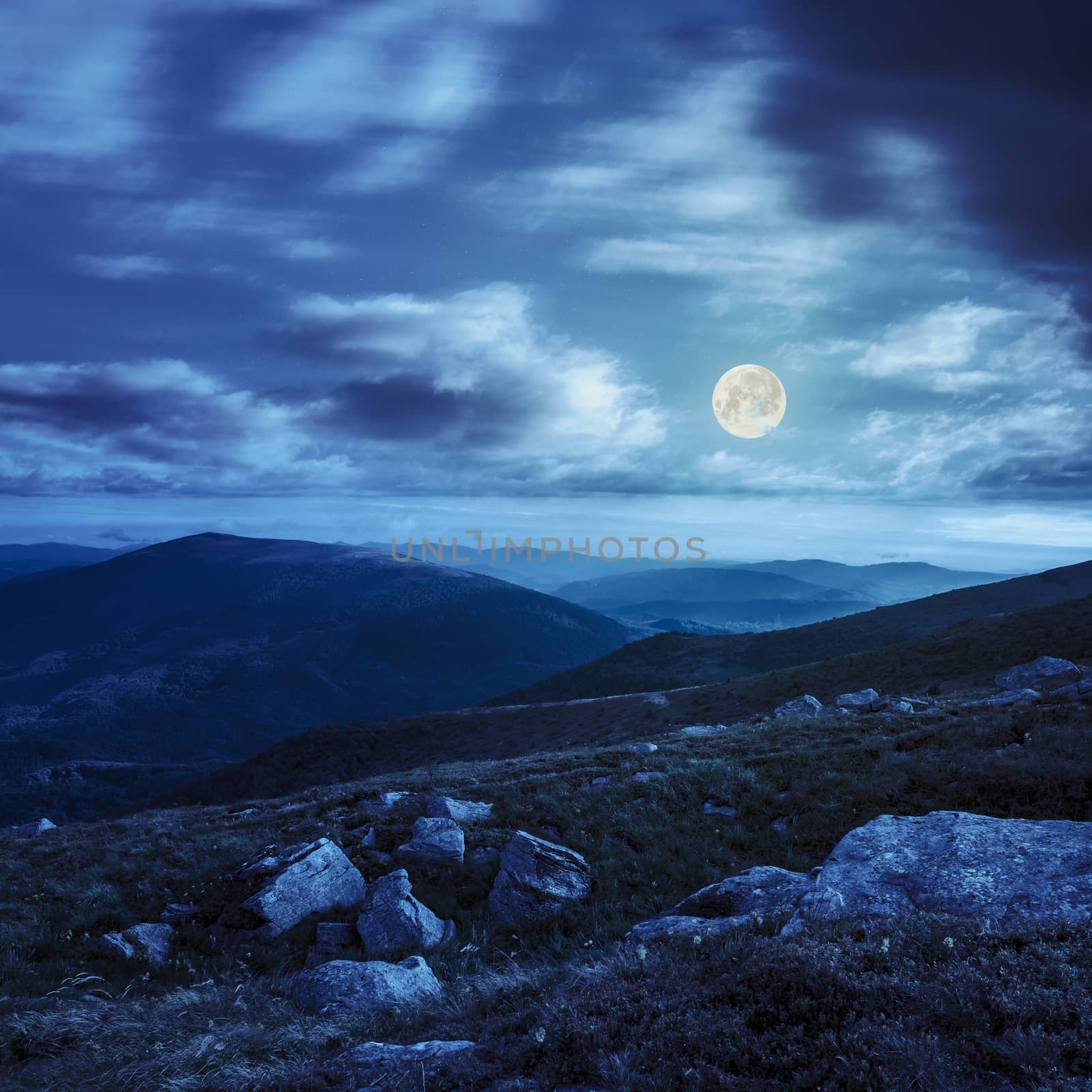 mountain hillside with white boulders at night by Pellinni