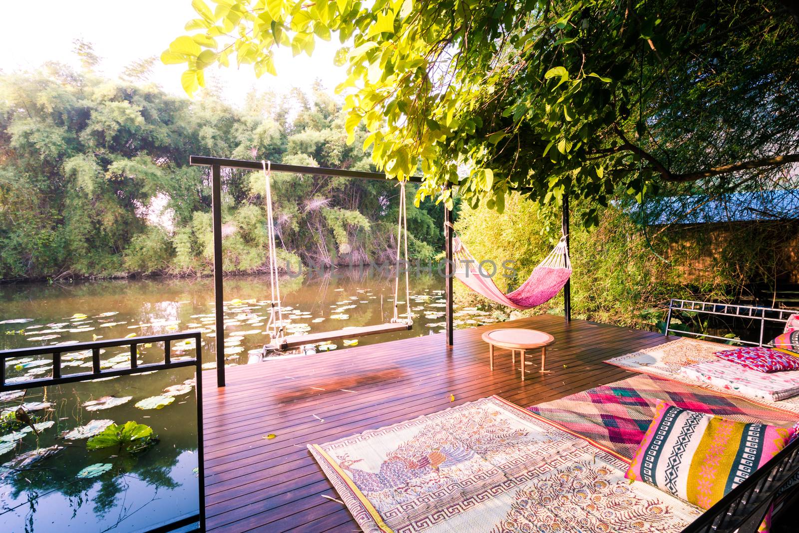 Wooden terrace under tree locate on swamp for massage 