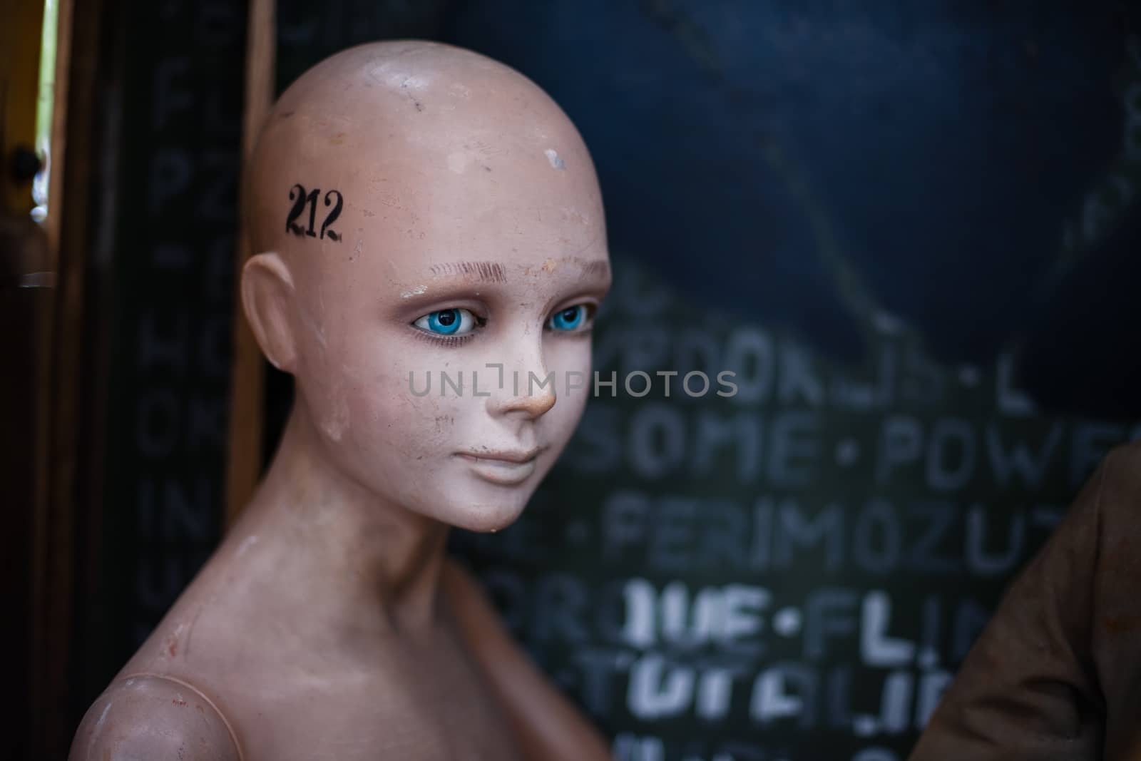 Old scary shabby damaged mannequin. Damaged doll