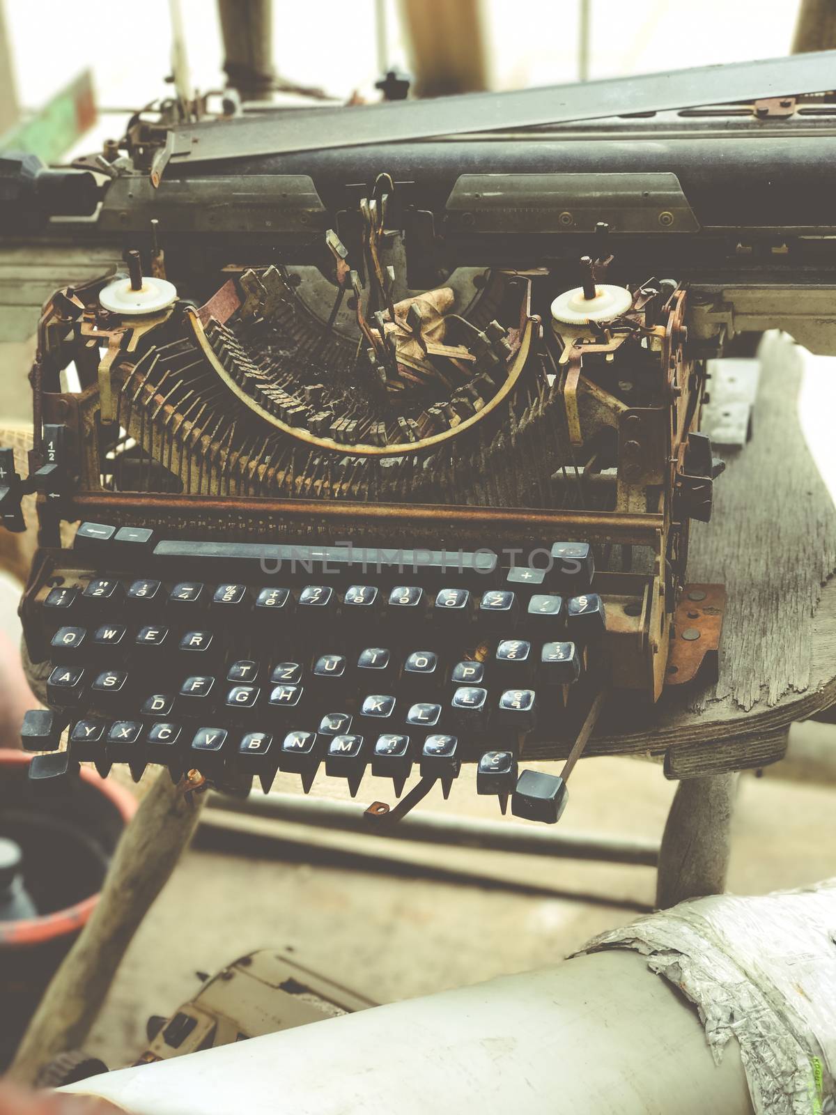 Old retro unnecessary faulty typewriter, professional writer equipment by Softulka