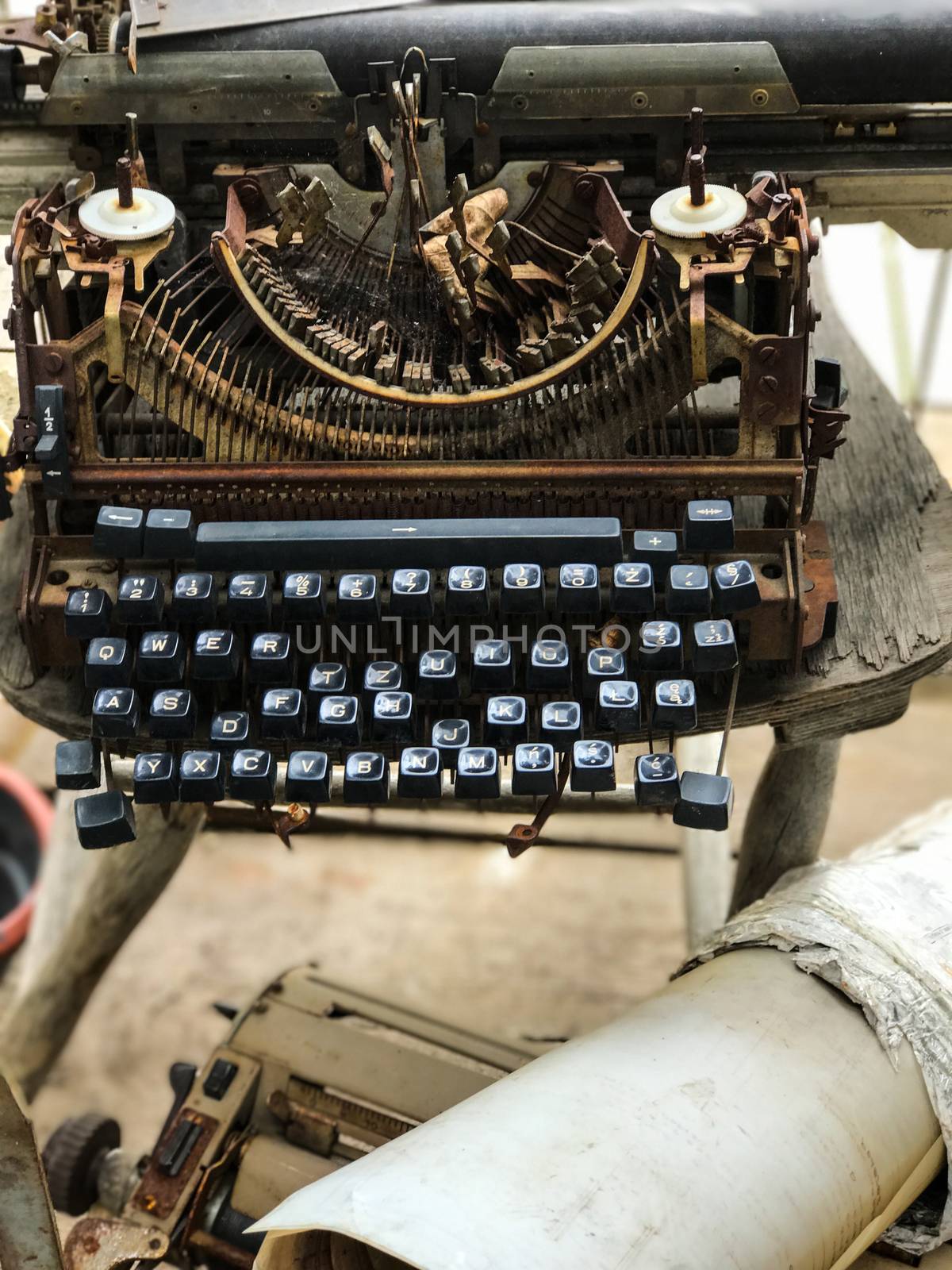 Old retro unnecessary faulty typewriter, professional writer equipment by Softulka