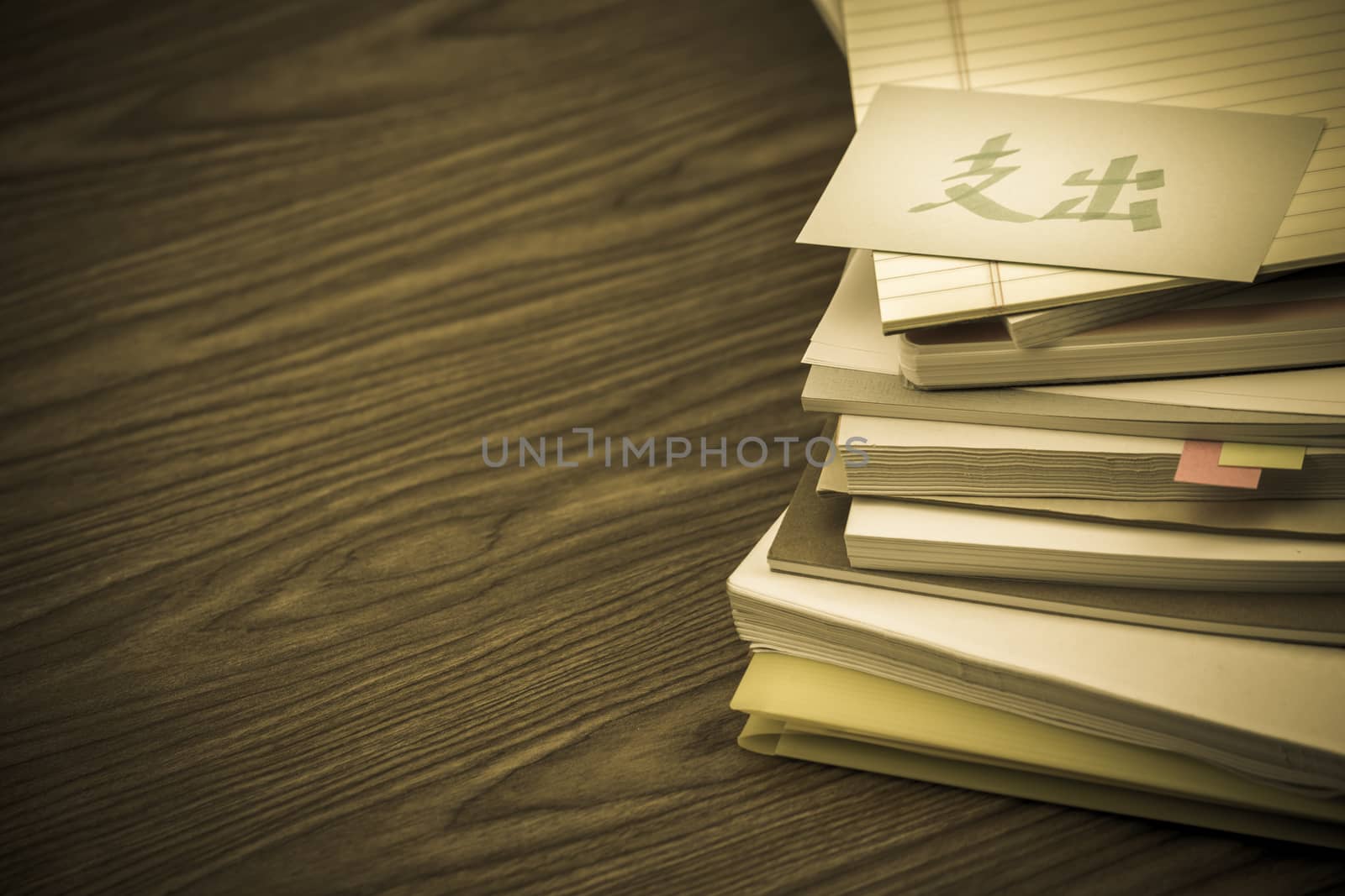 Pay Out; The Pile of Business Documents on the Desk (Translation; Expenses)