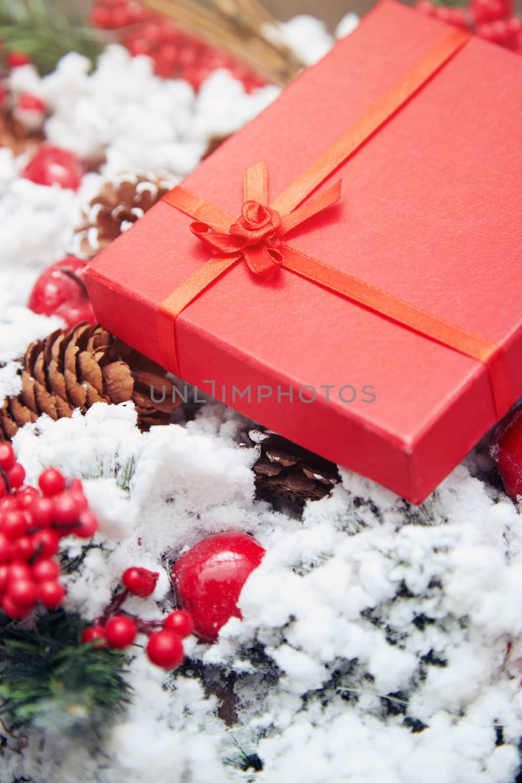 Christmas gift in a red box. Close-up horizontal photo