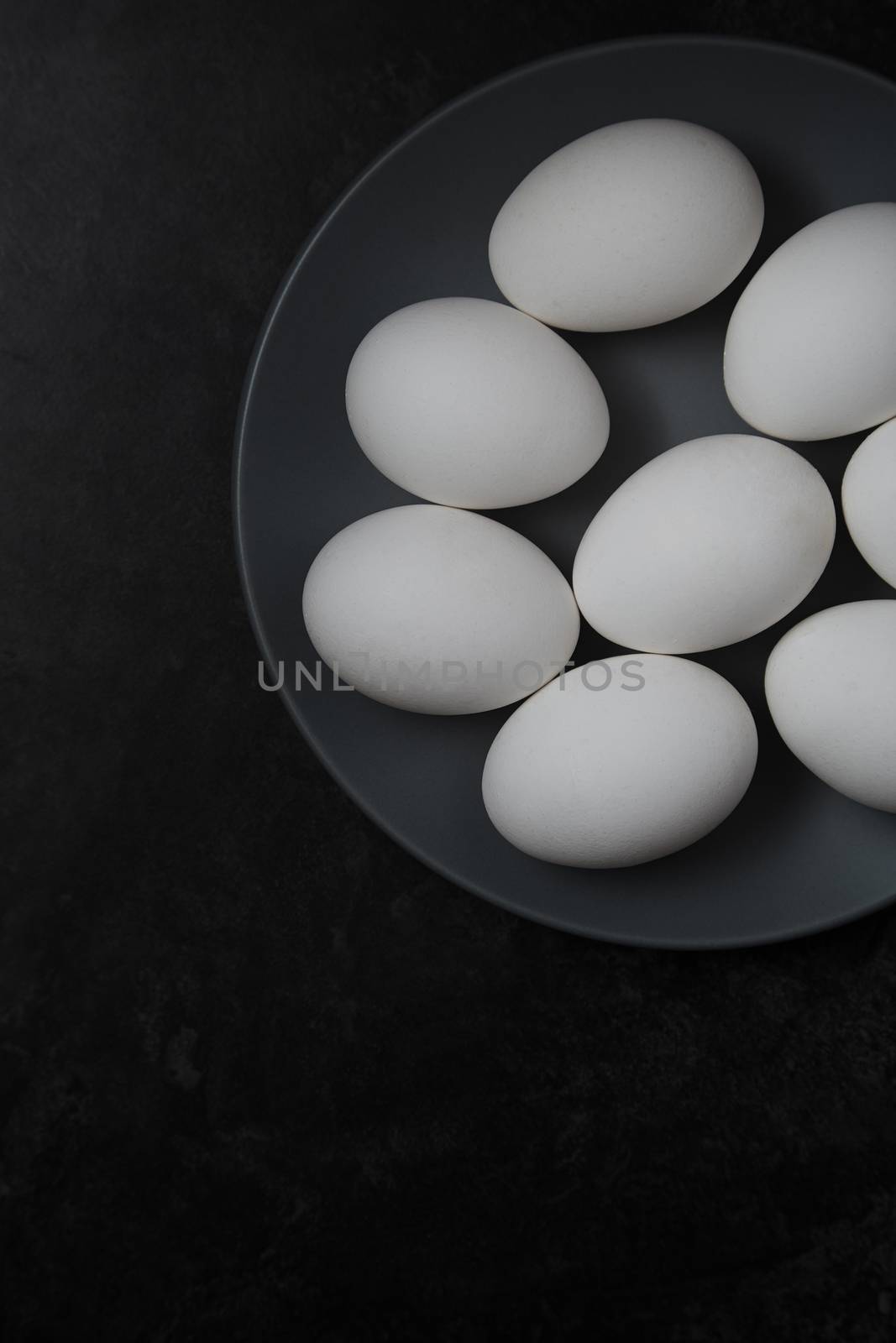 Chicken eggs on a plate. View from above