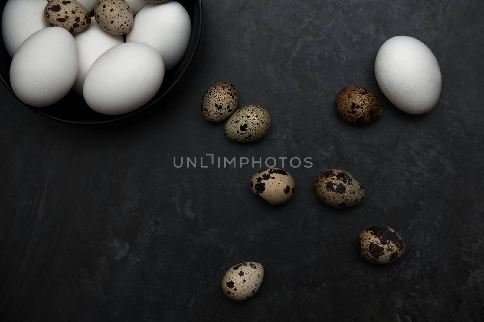 Quail and chicken eggs on a table
