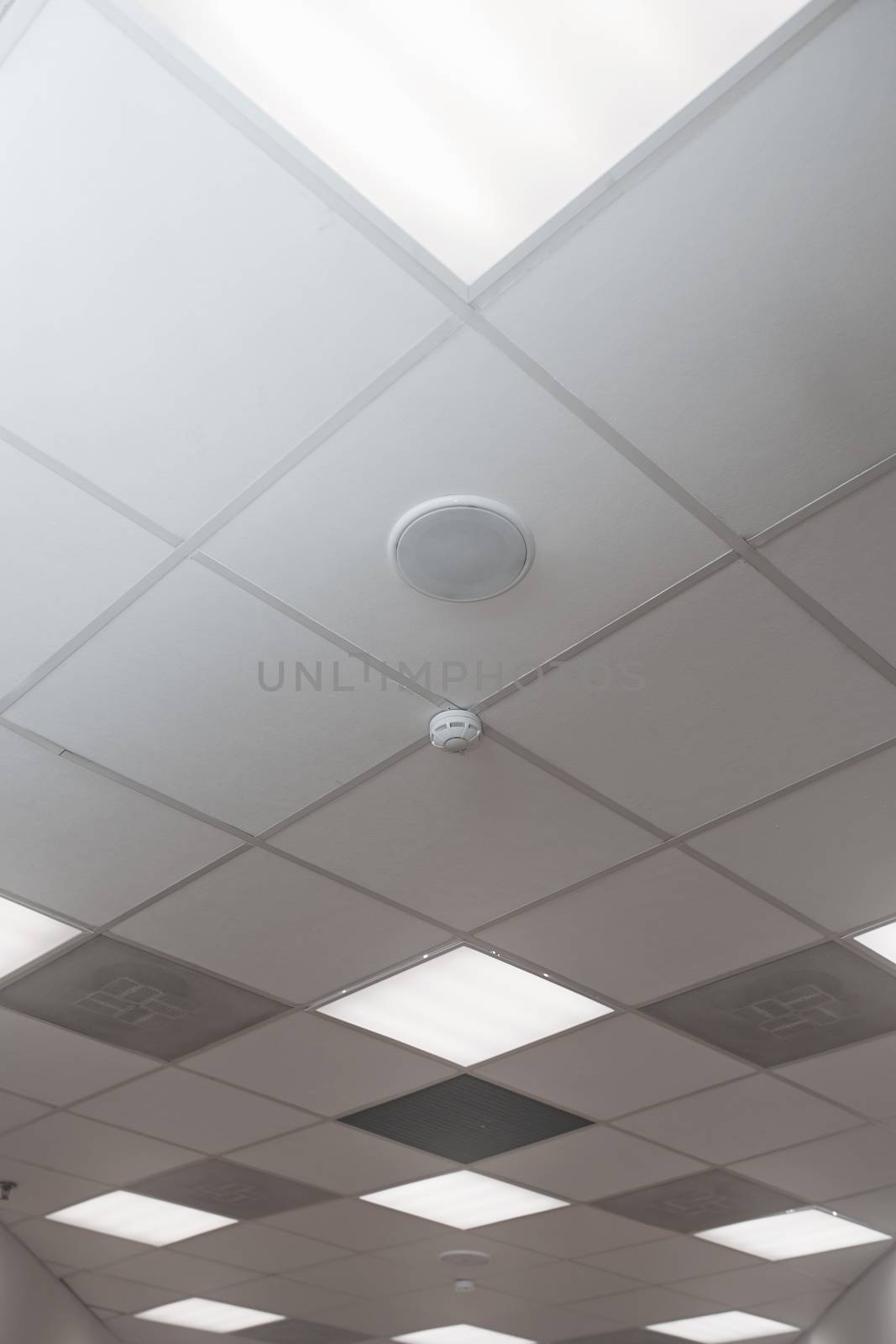 Office room ceiling with smoke detector and alarm by Novic