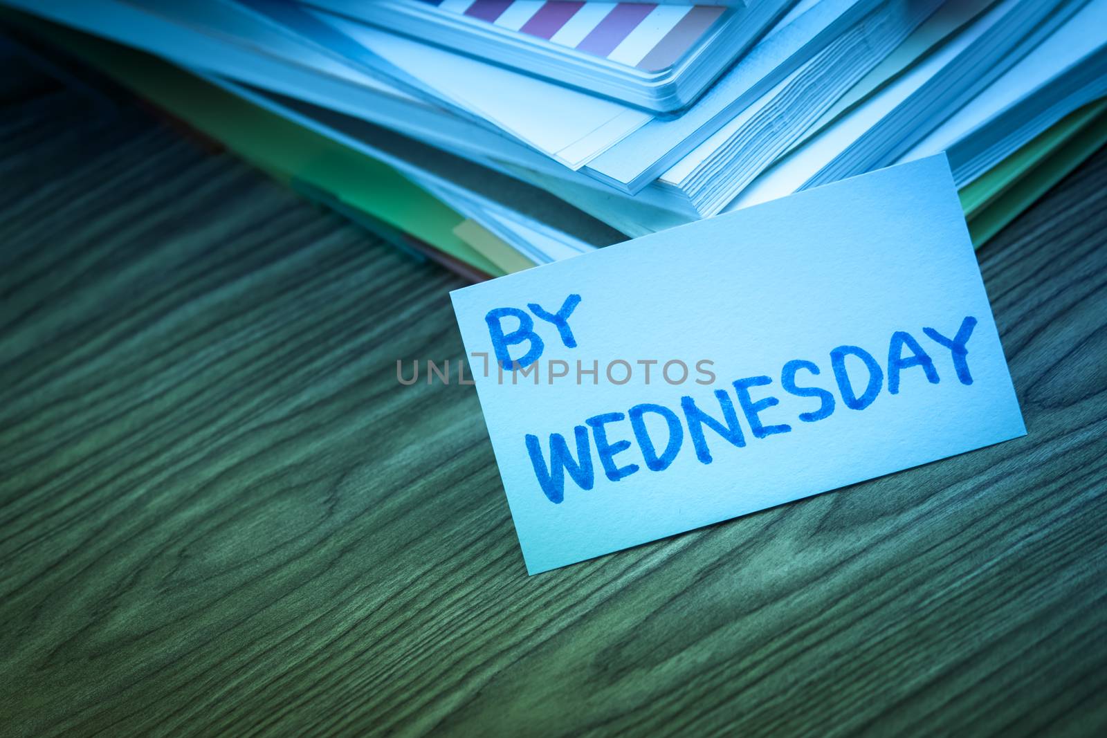 By Wednesday; The Pile of Business Documents on the Desk