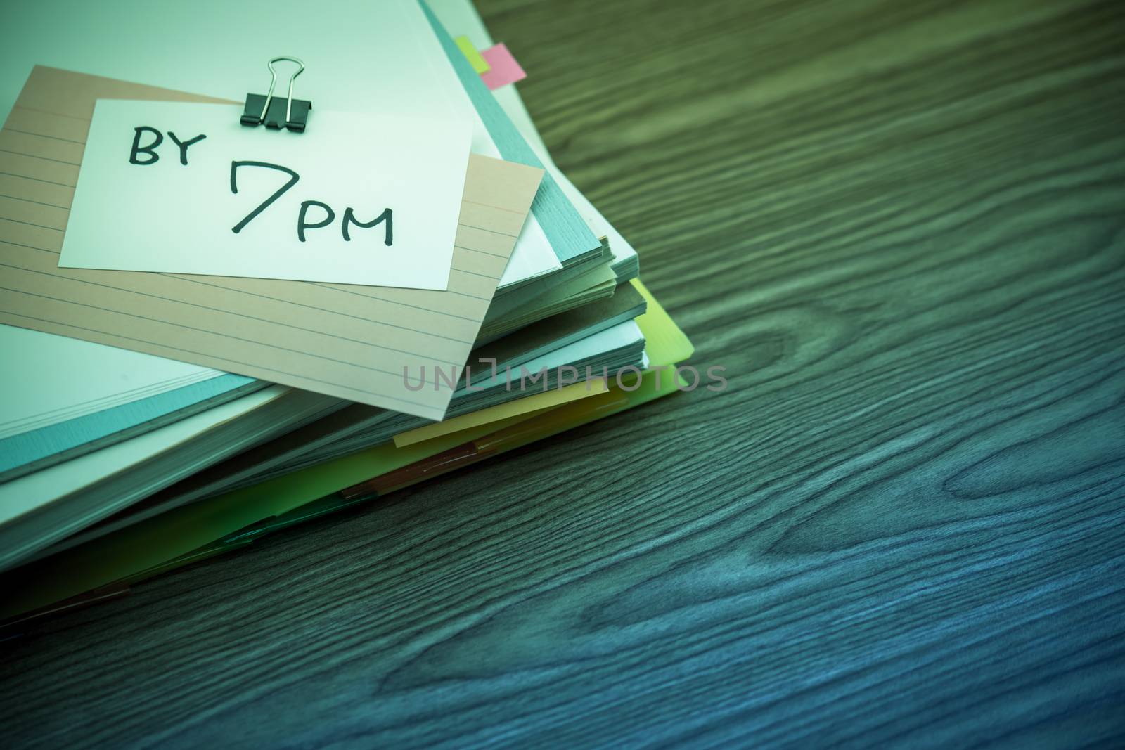 By 7 PM; The Pile of Business Documents on the Desk