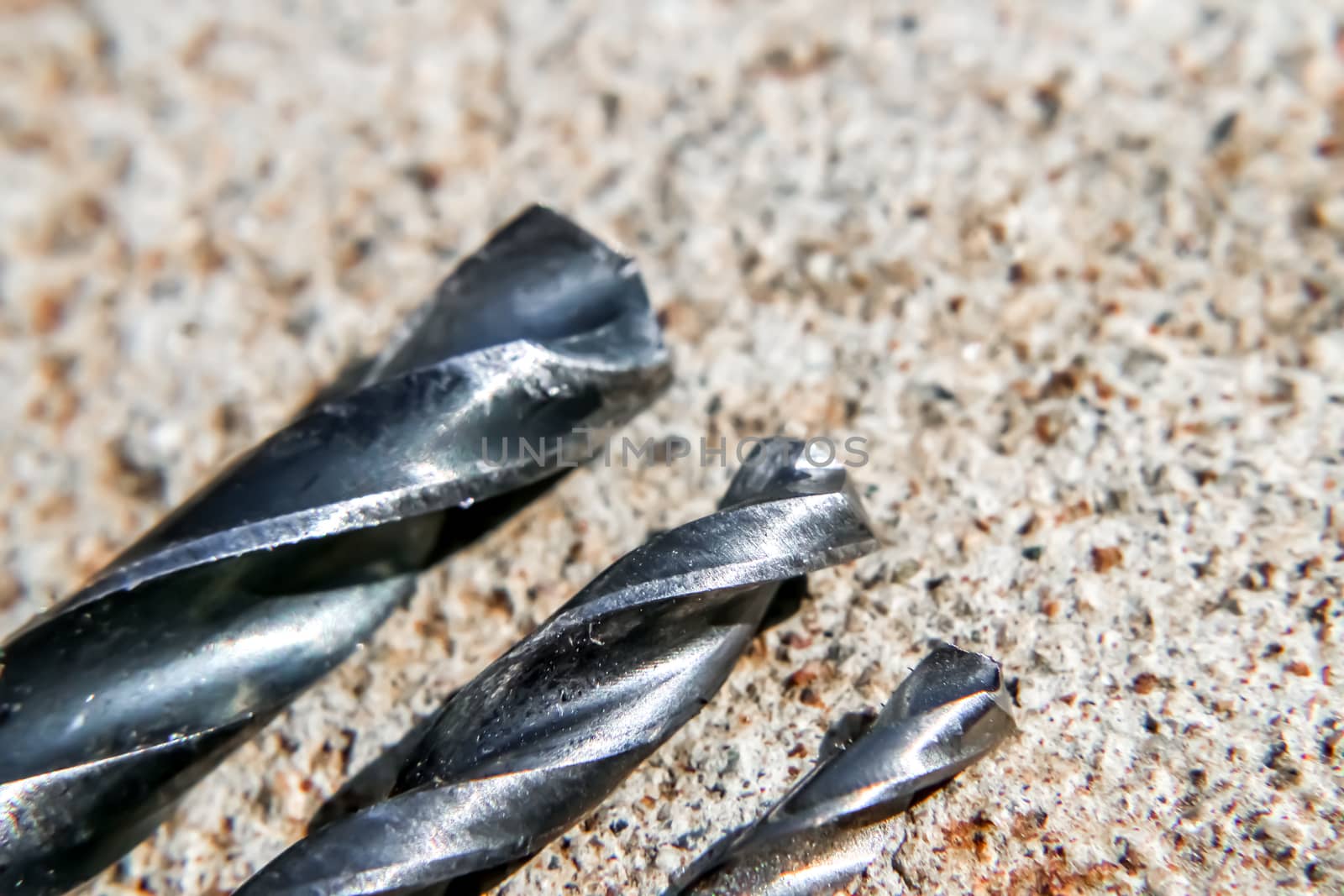 The Isolated Drill Bits with the Gray Ground Background