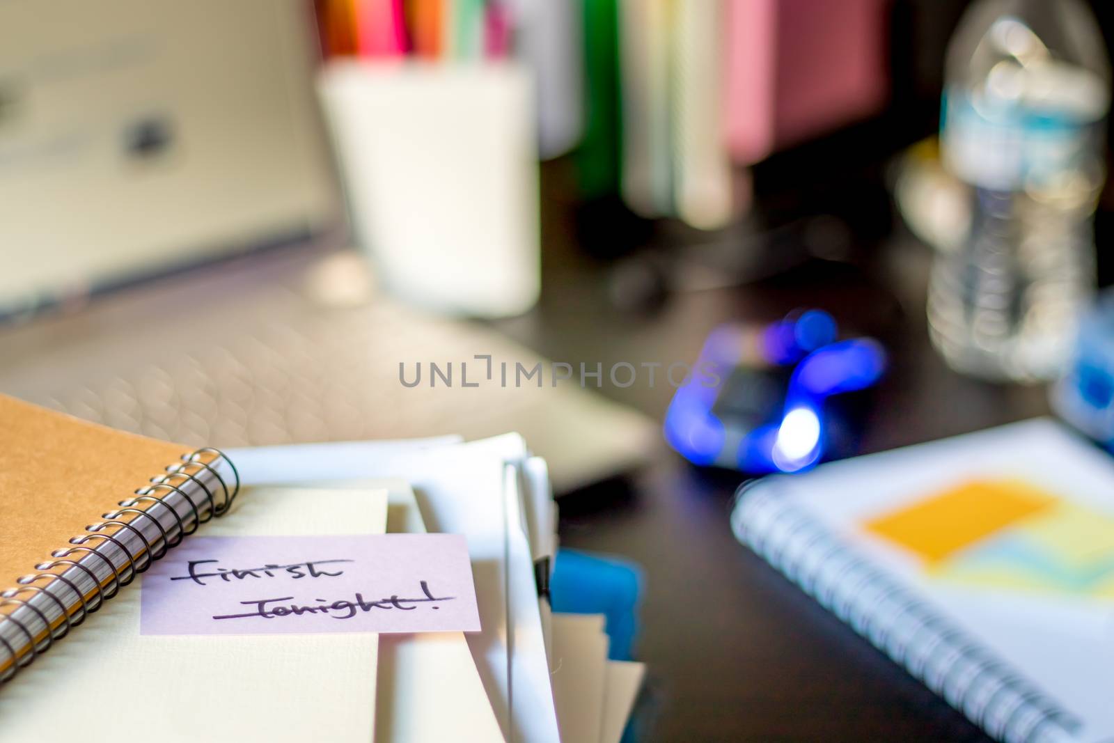 Finish Tonight, Done; Stack of Documents and Laptop at working Desk.