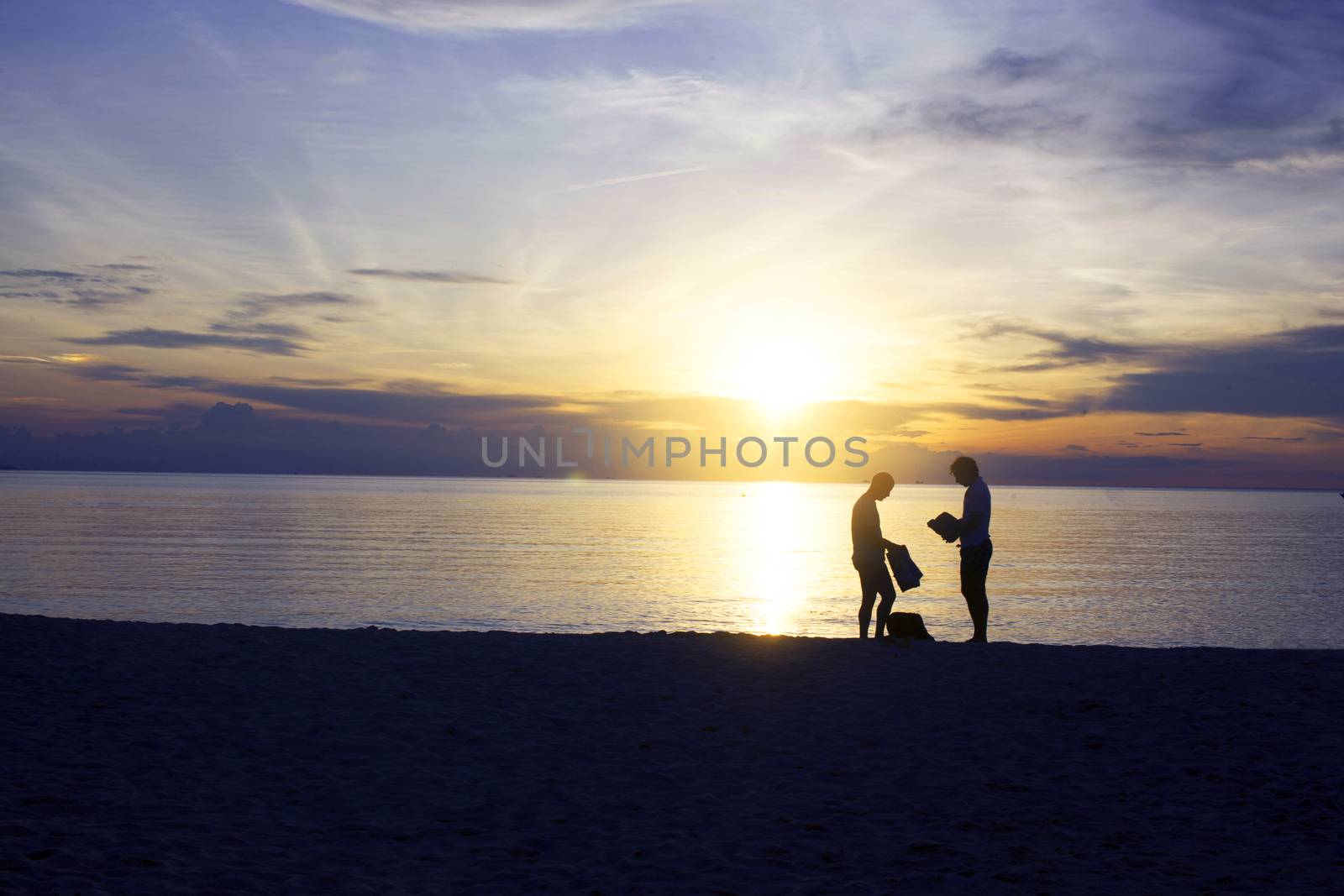 Silhouette of gay couple by Bowonpat