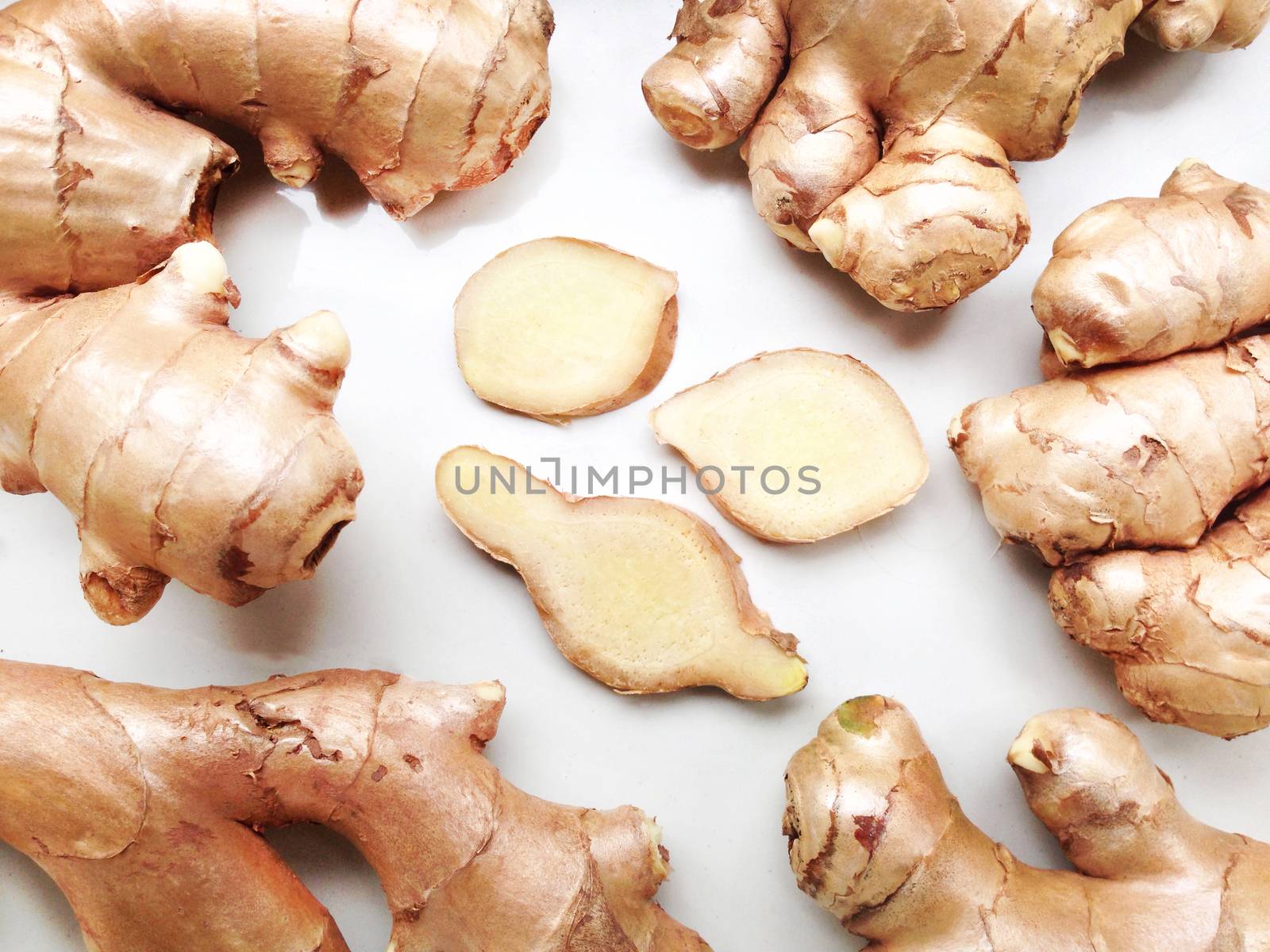 Fresh ginger on white background by Bowonpat