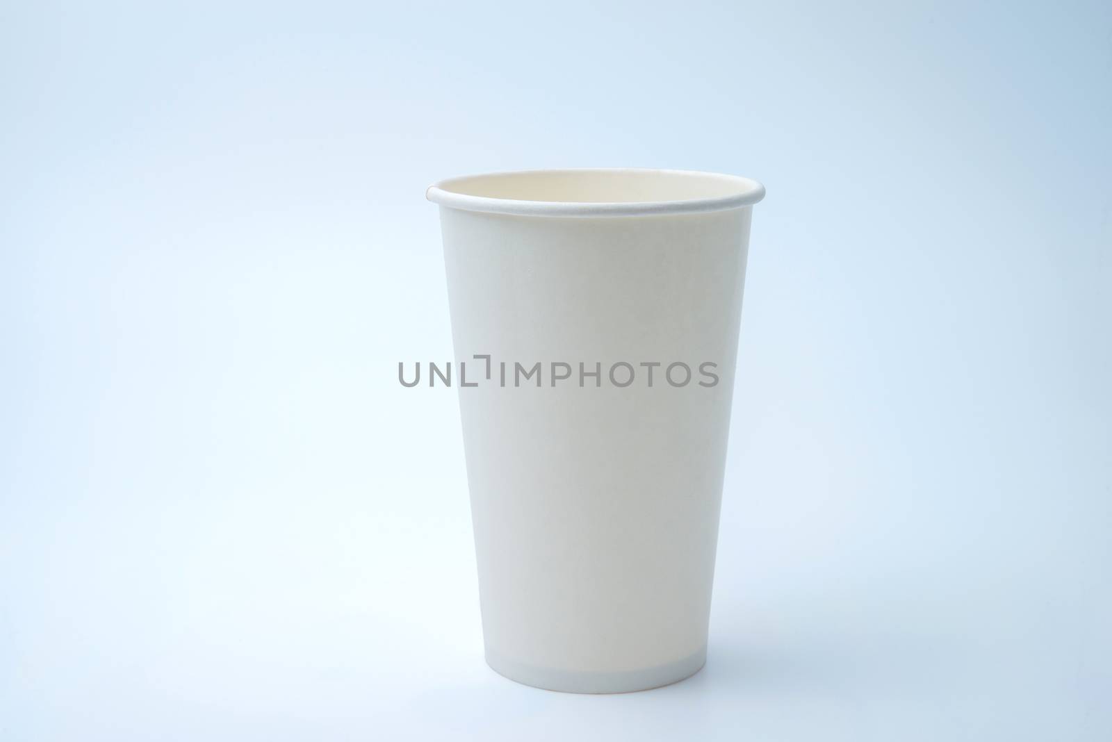 paper cup of coffee on white background by antpkr