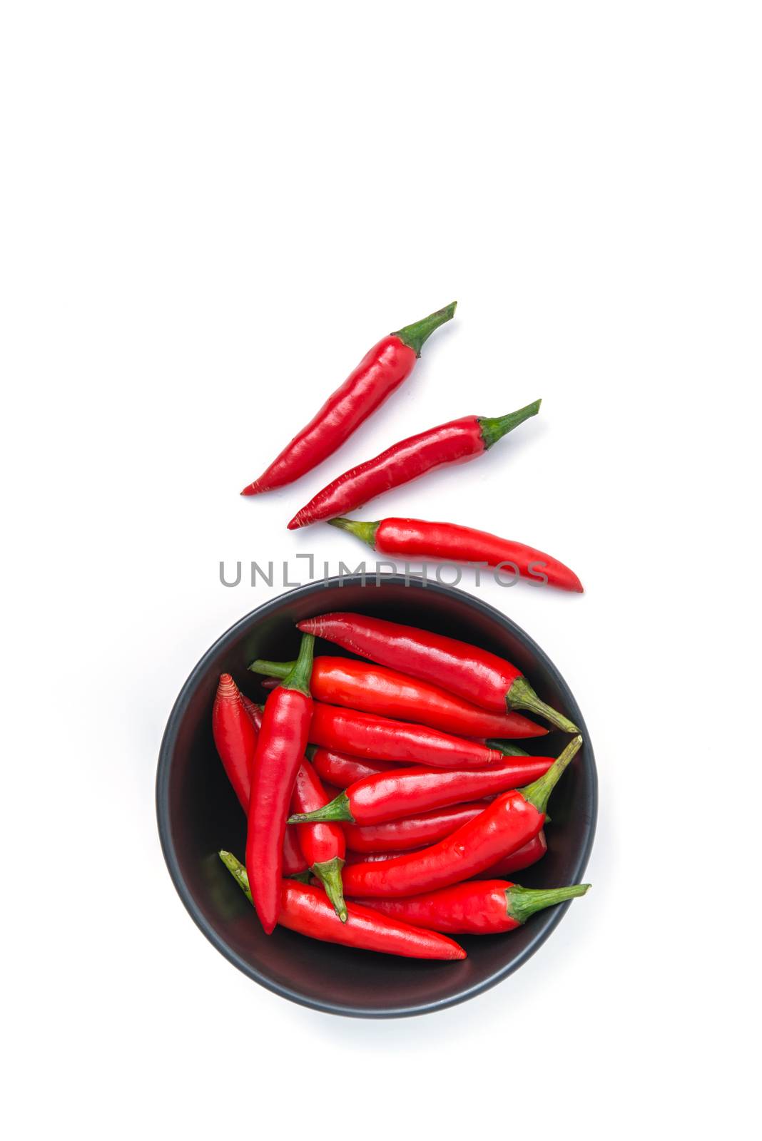 top view of red pepper in a bowl isolated on white background by antpkr