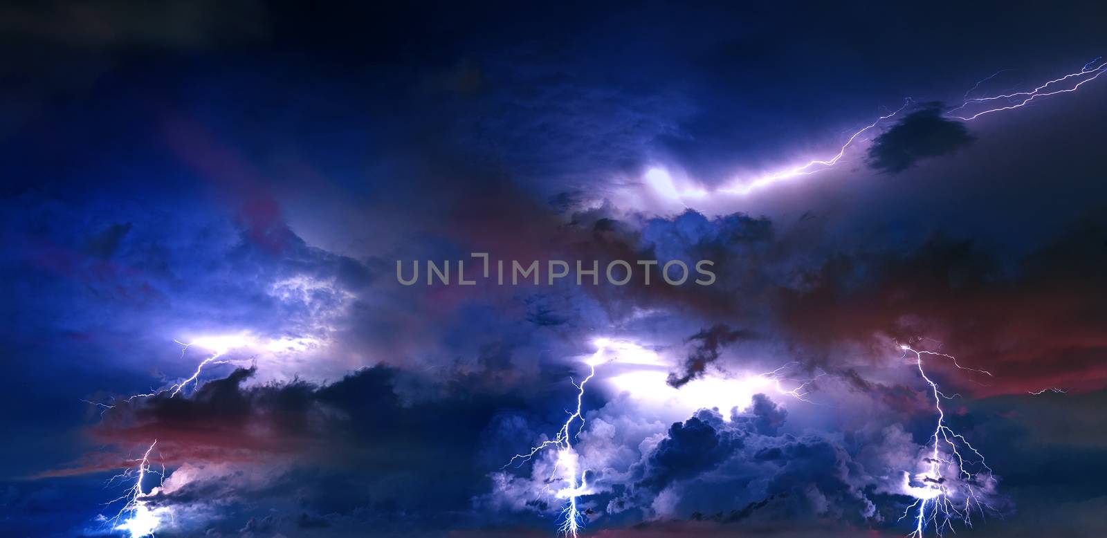 Thunderstorm clouds with lightning at night. by gutarphotoghaphy