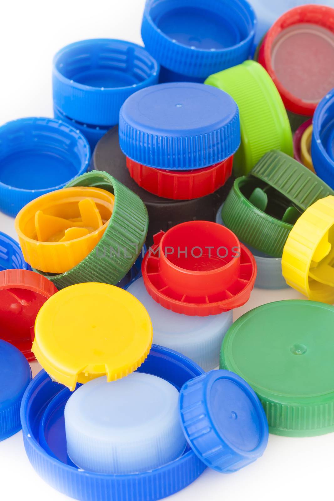 Colorful plastic bottle caps closeup, recycled garbage