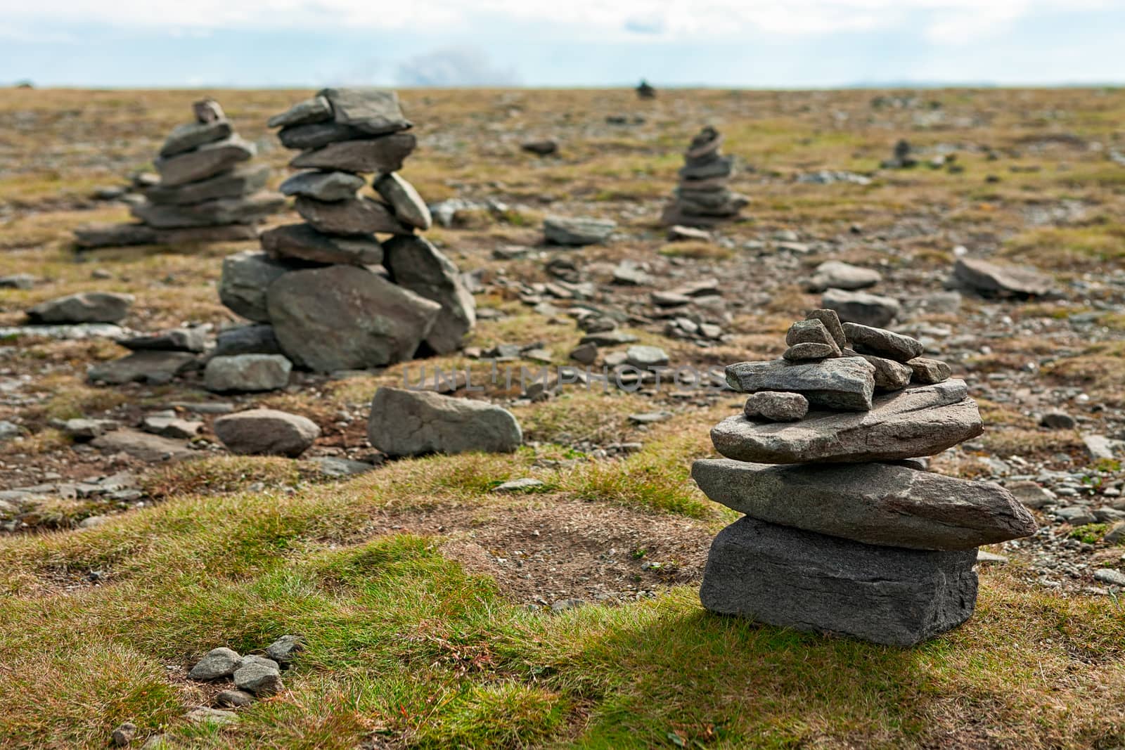 Pile of stones in North Cape in Mageroya island, the most northerly point of Europe, Norway