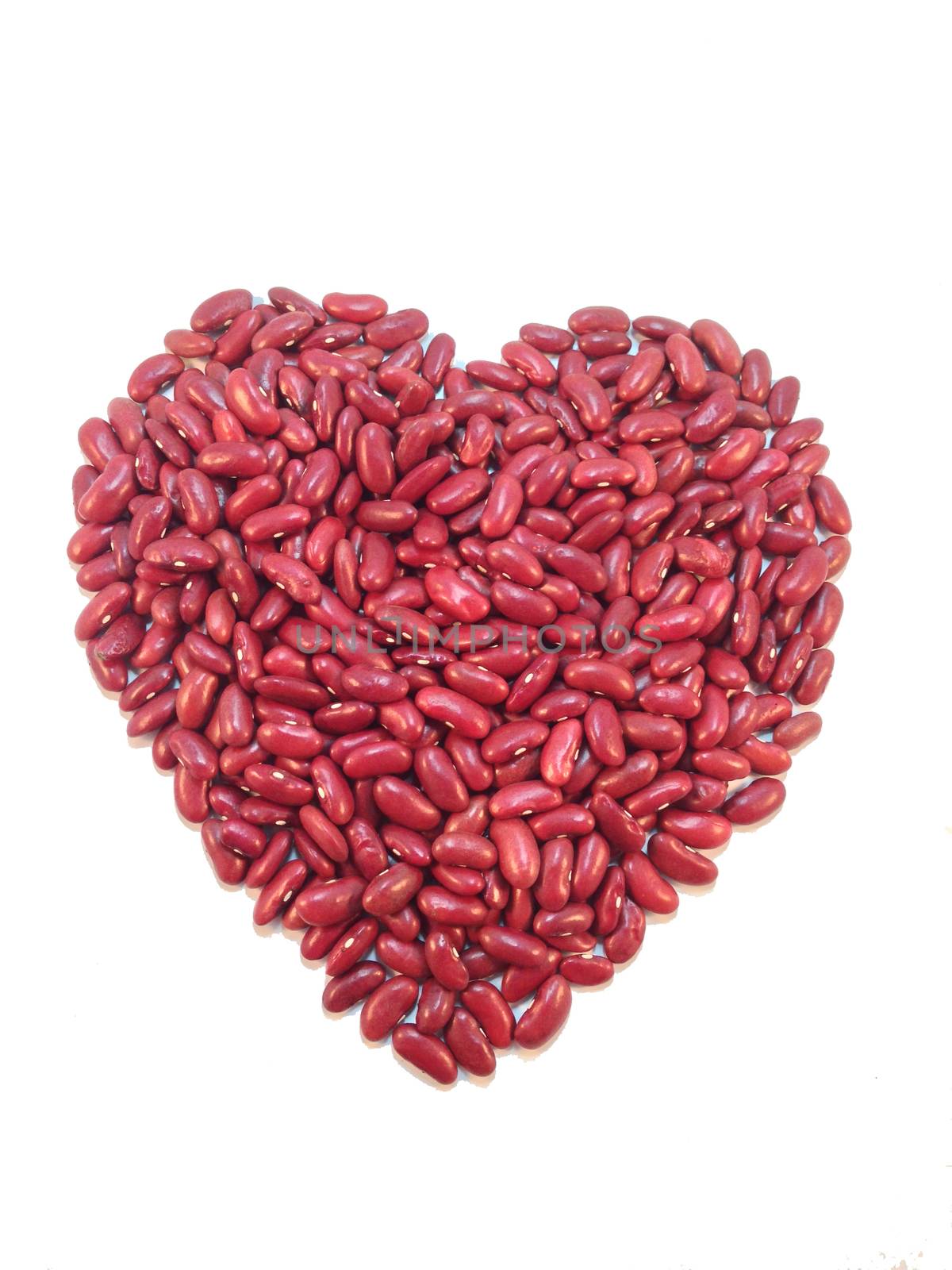 Heart shaped red bean on white background