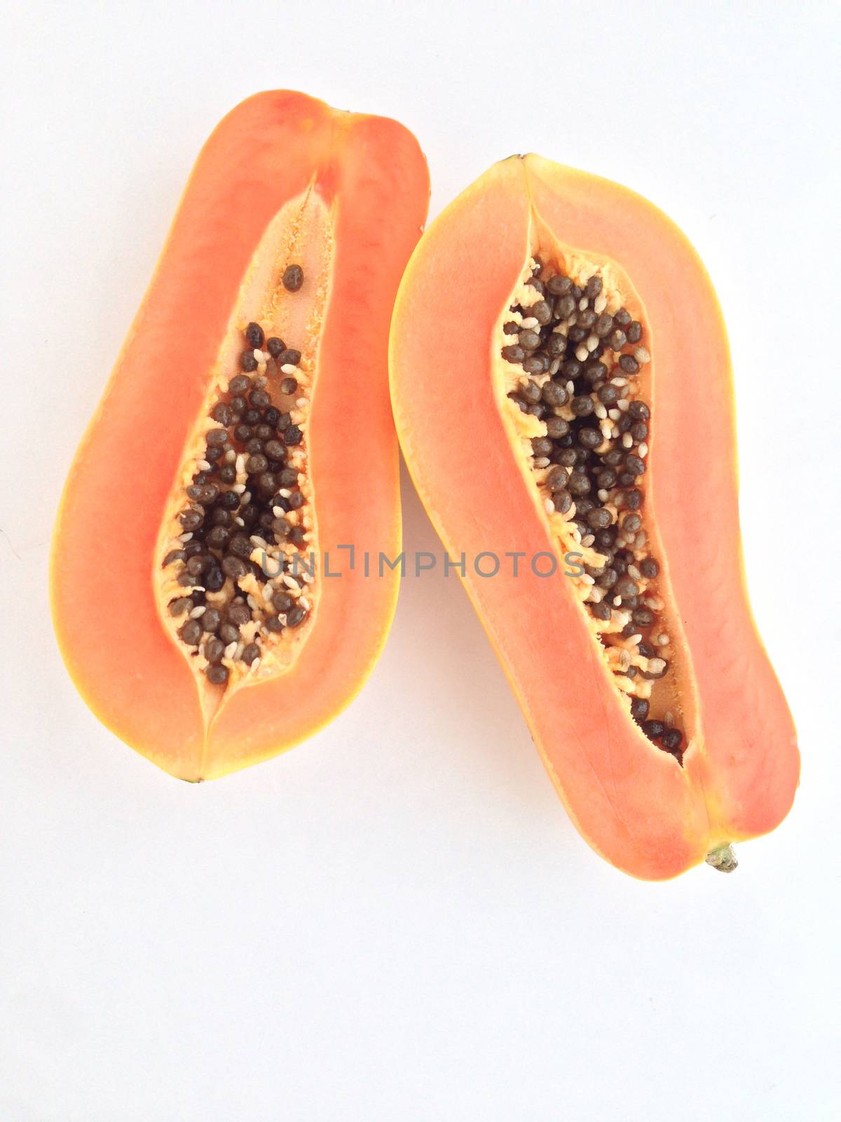 slices of sweet papaya on white background