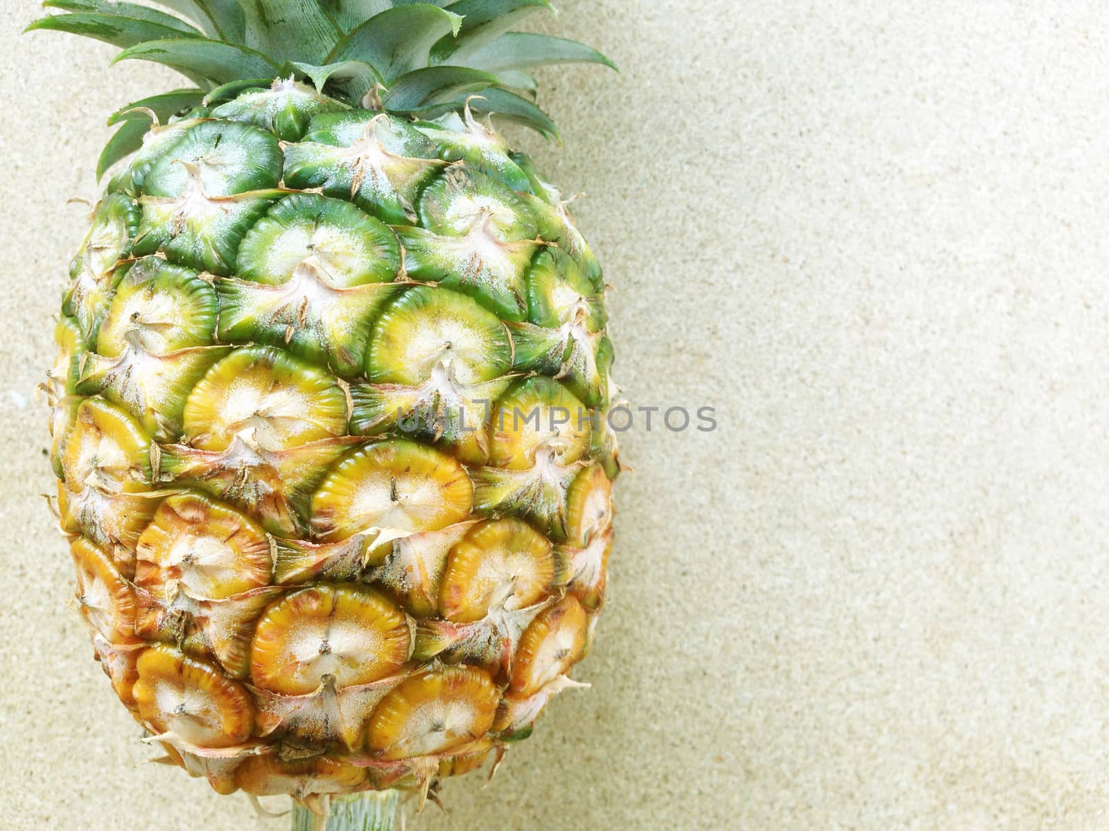 pineapple isolated on plywood background