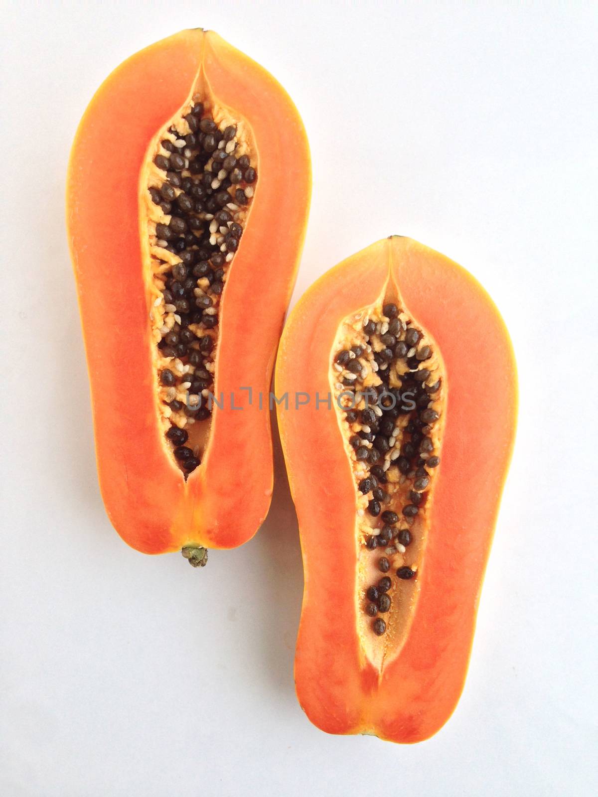 slices of sweet papaya on white background