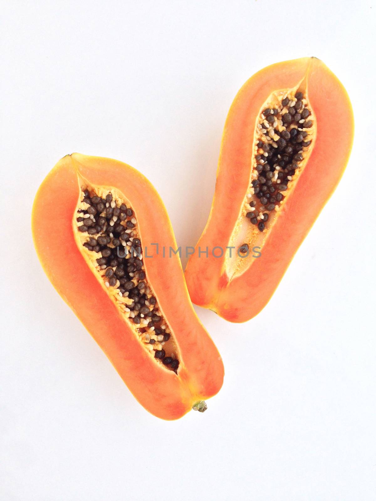 slices of sweet papaya on white background by Bowonpat