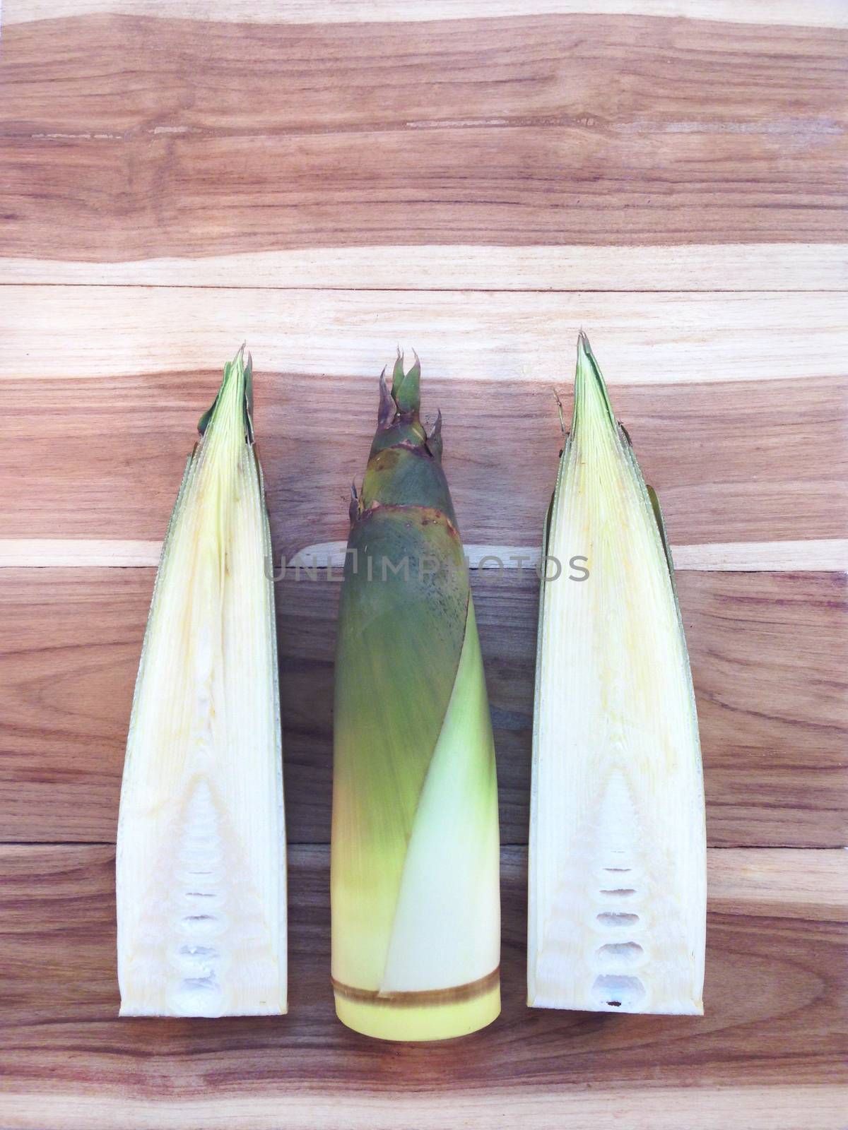 Bamboo shoots  on wooden background  by Bowonpat