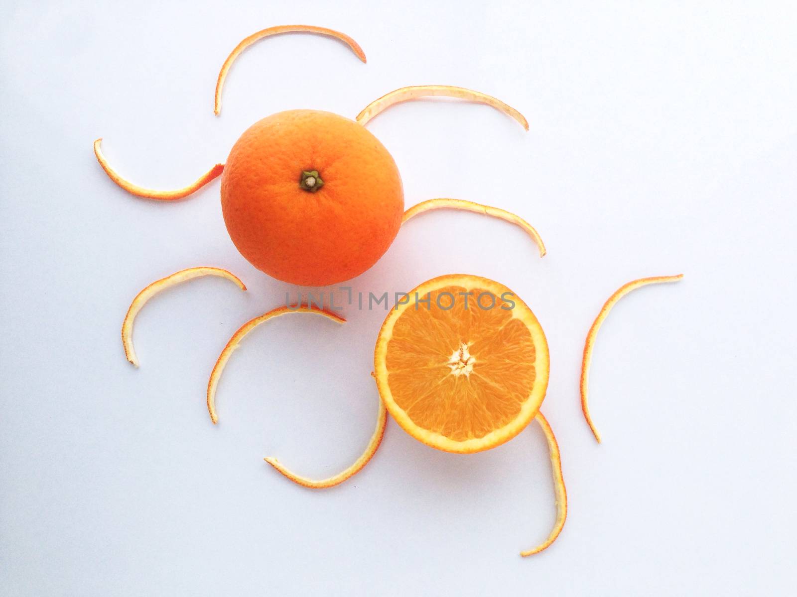 Fresh orange and slices on white background.