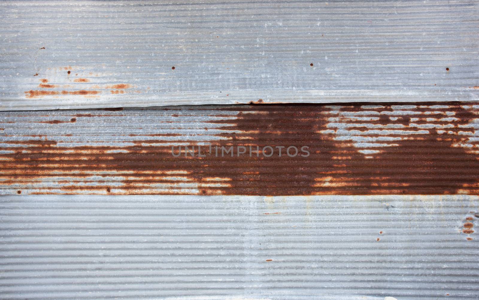 Old rusty zinc sheets for textured abstract background by Bowonpat