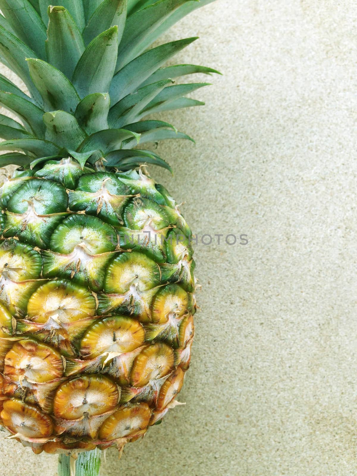 pineapple isolated on plywood background by Bowonpat