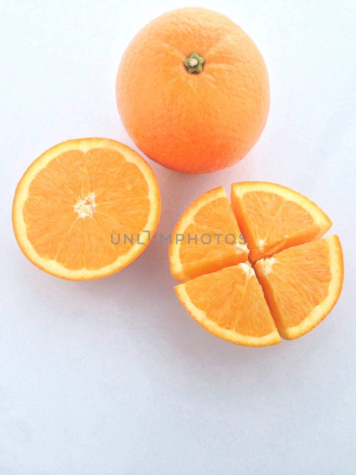 Fresh orange and slices on white background.