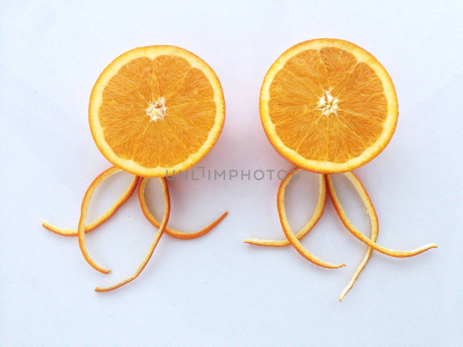 Fresh orange and slices on white background.