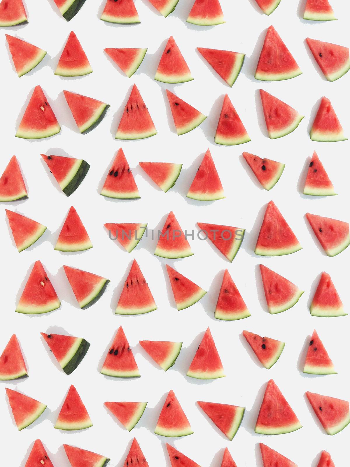 slices of watermelon on white background by Bowonpat