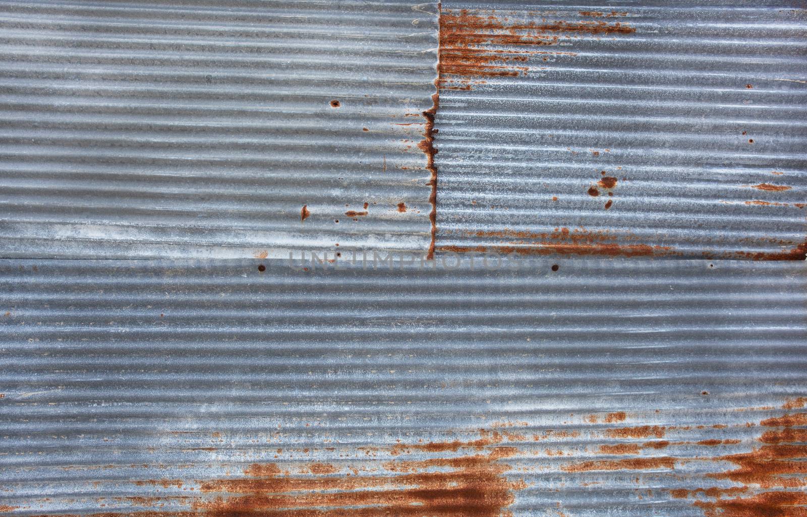 Old rusty zinc sheets for textured abstract background by Bowonpat