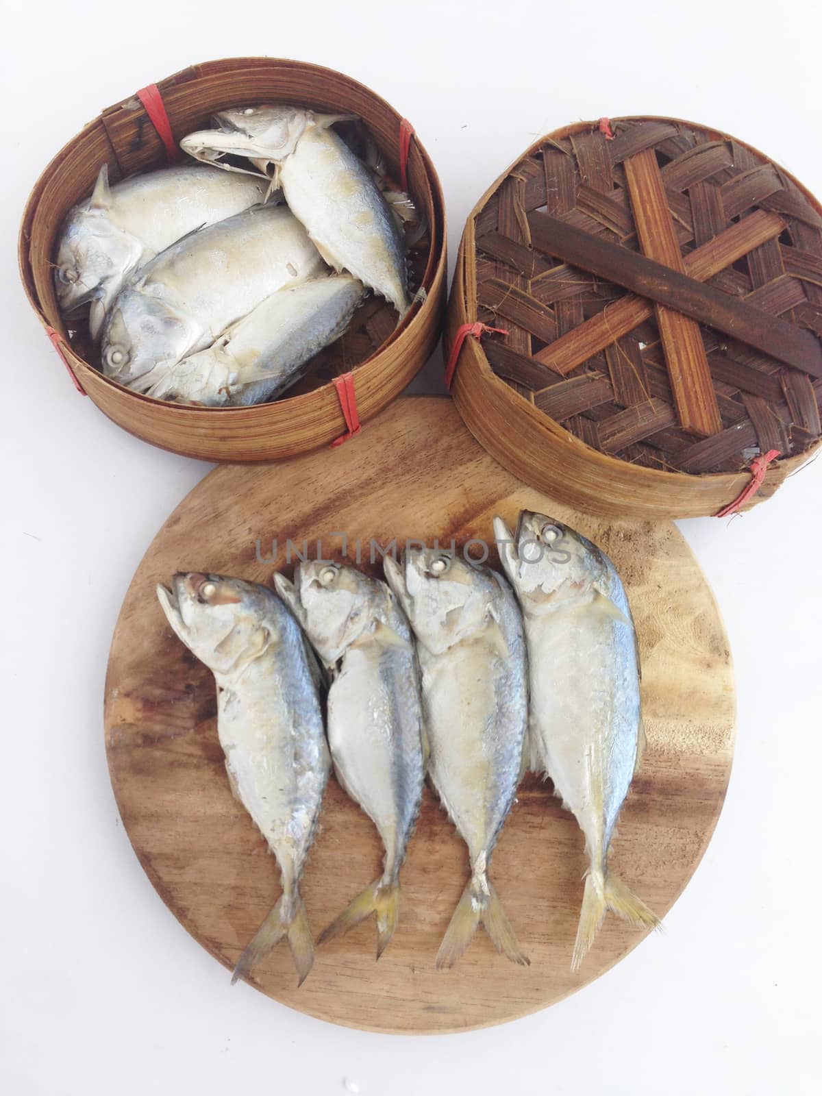 short mackerel on cutting board with fish basket