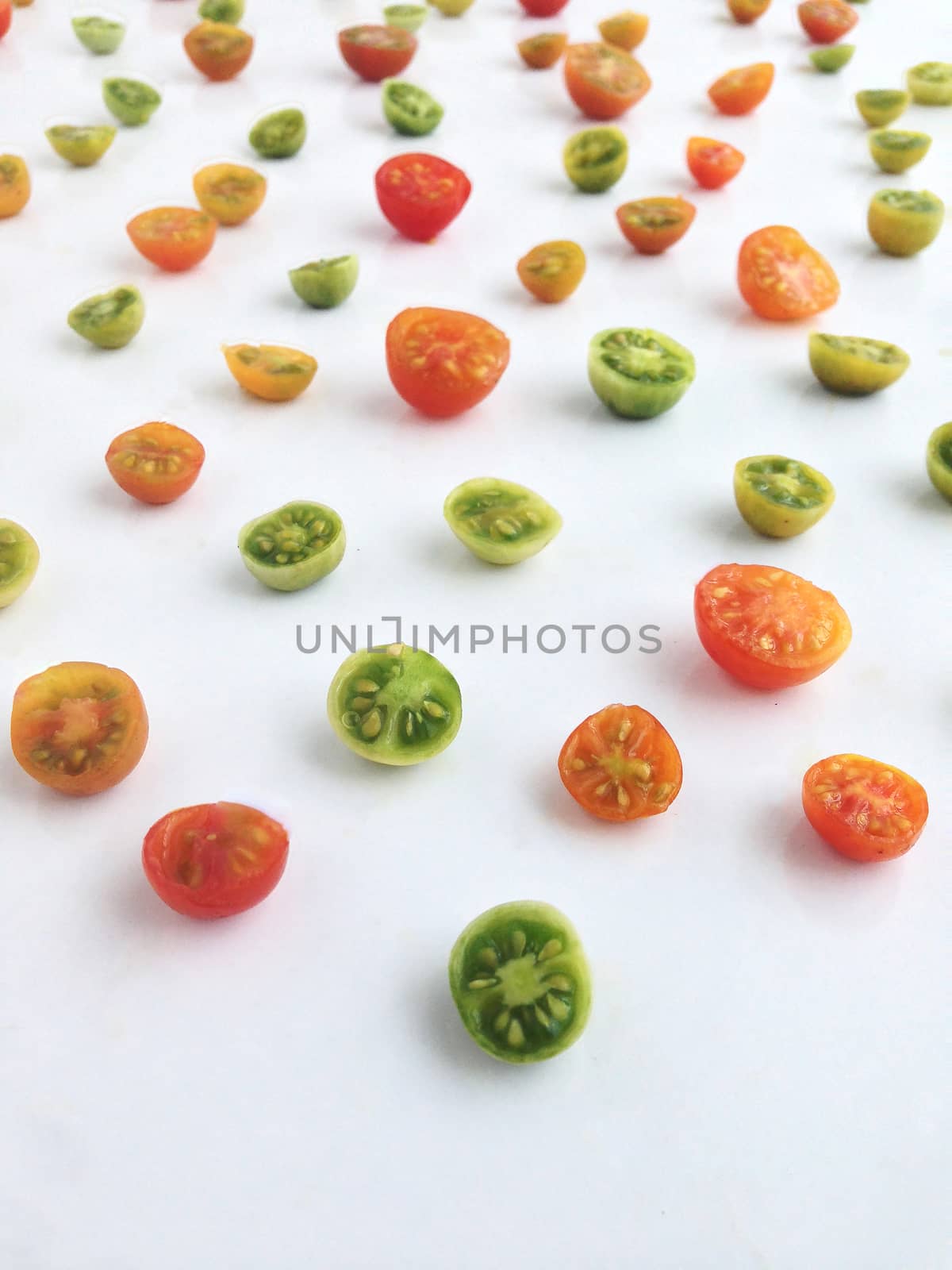 Colorful slices tomatoes by Bowonpat