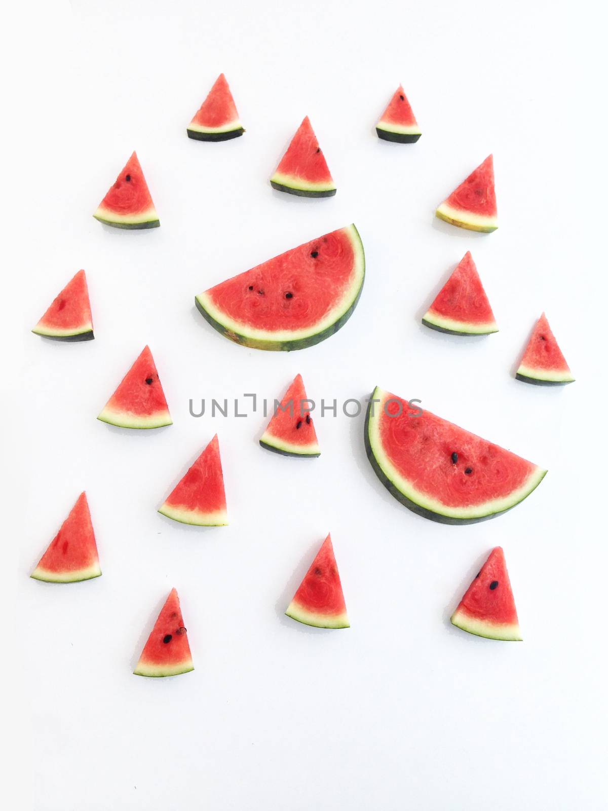 slices of watermelon on white background by Bowonpat