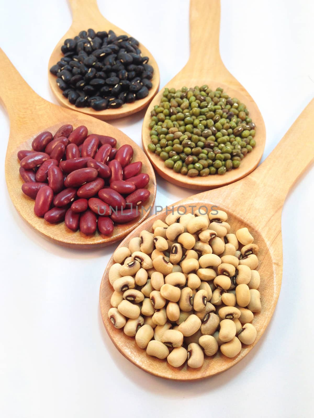 Varieties of beans, peas on white background