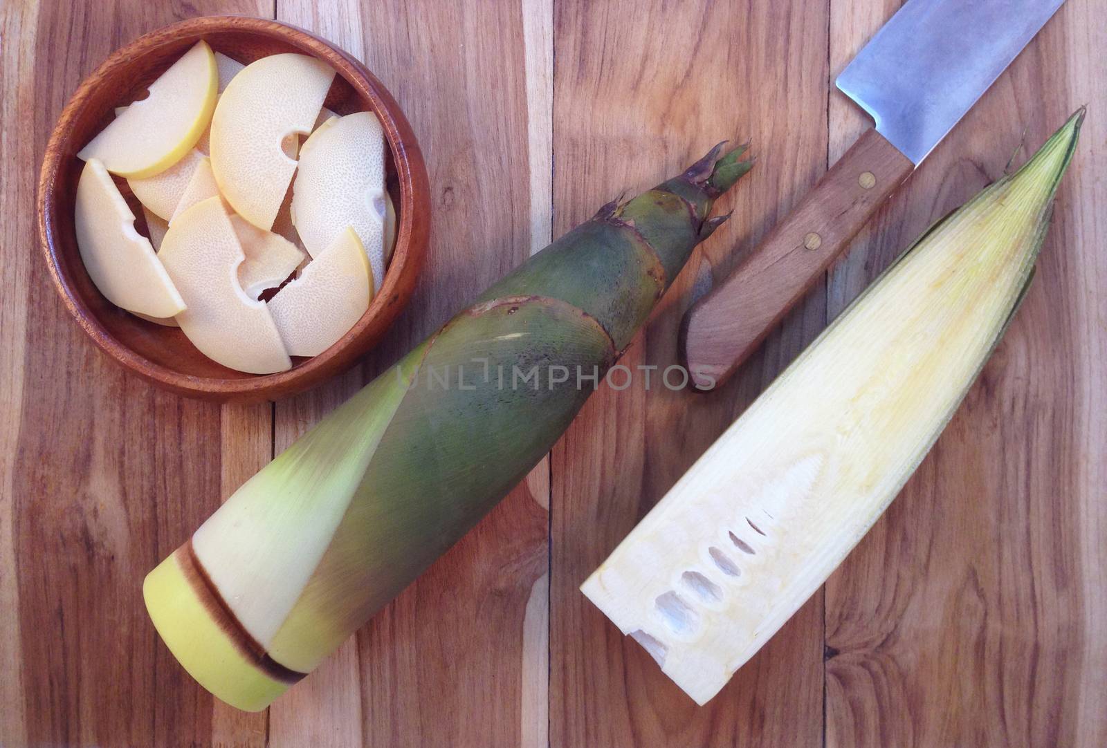 Bamboo shoots and Bamboo shoots slices in wooden bowl on wooden background