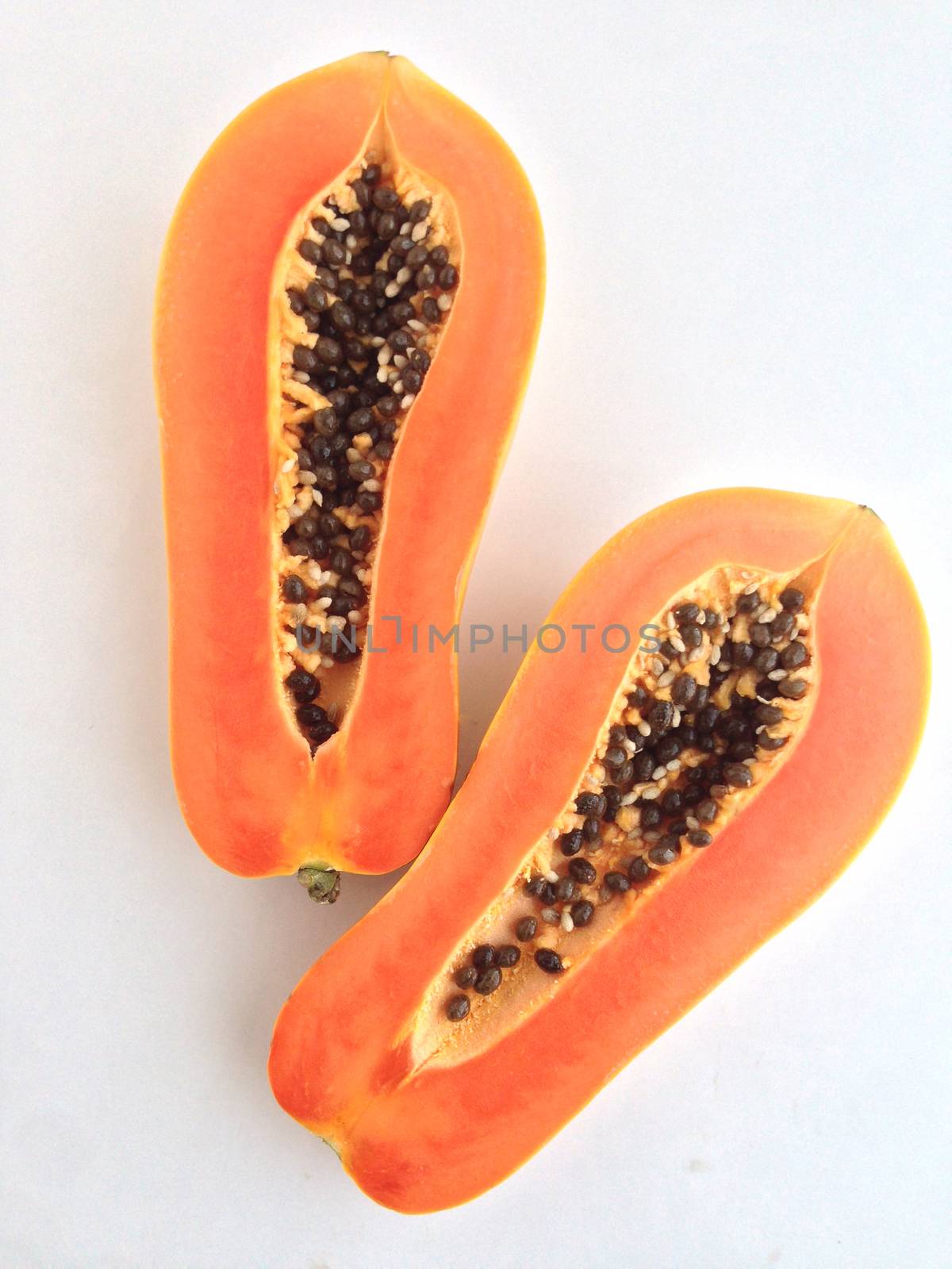 slices of sweet papaya on white background