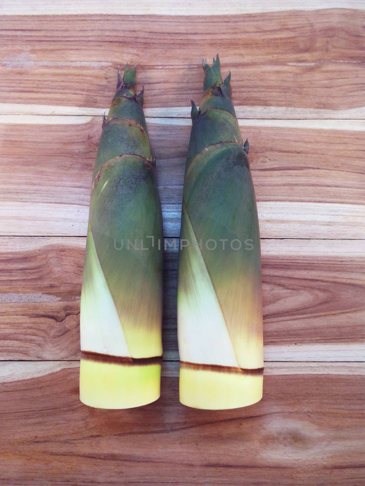 Bamboo shoots  on wooden background  by Bowonpat