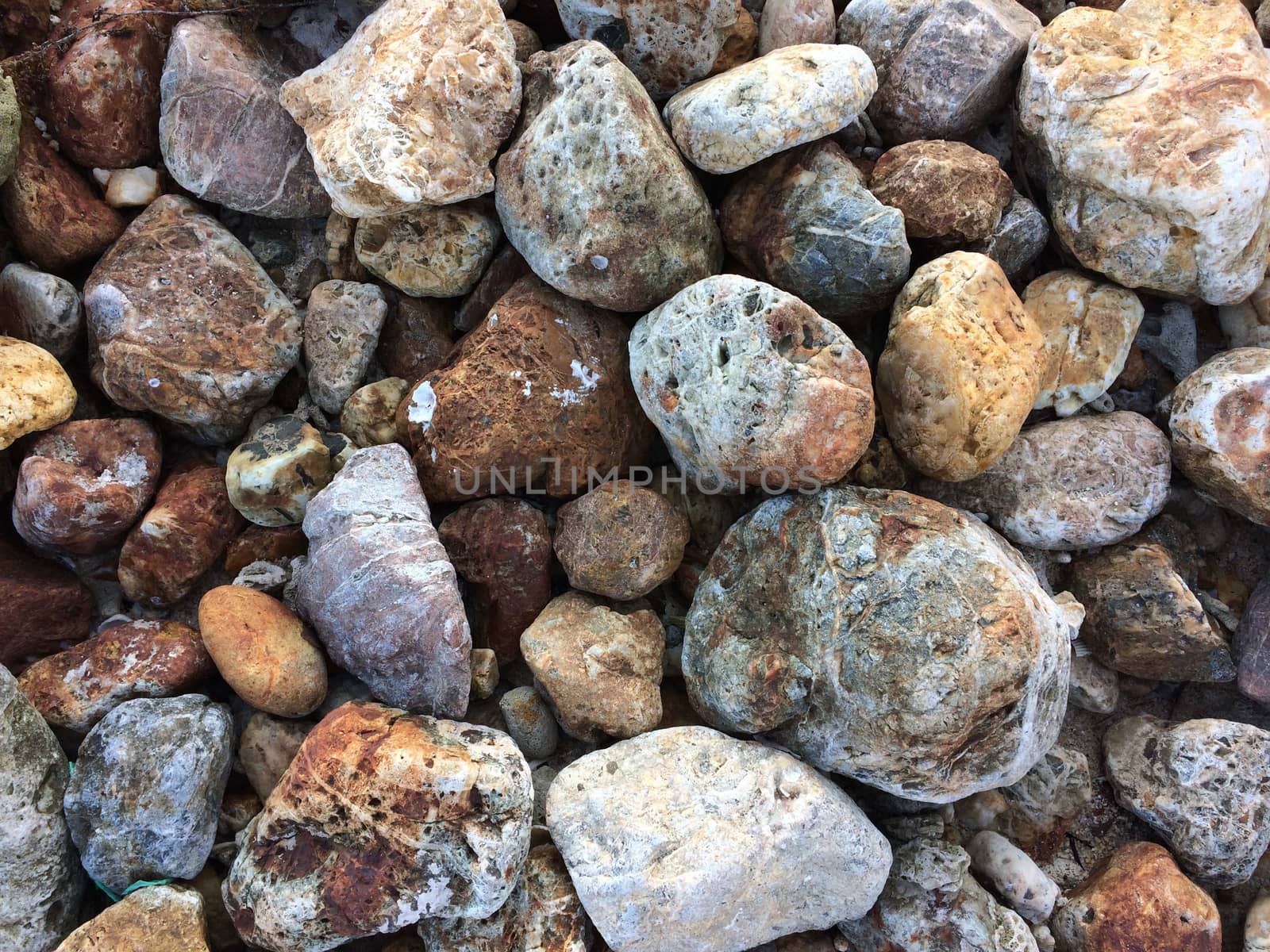 Brown white and grey rocks background by Bowonpat