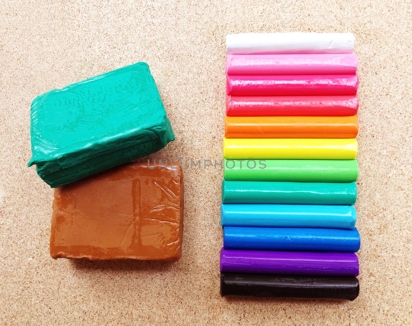 Clay palettes on plywood background. Rainbow colors
 by Bowonpat