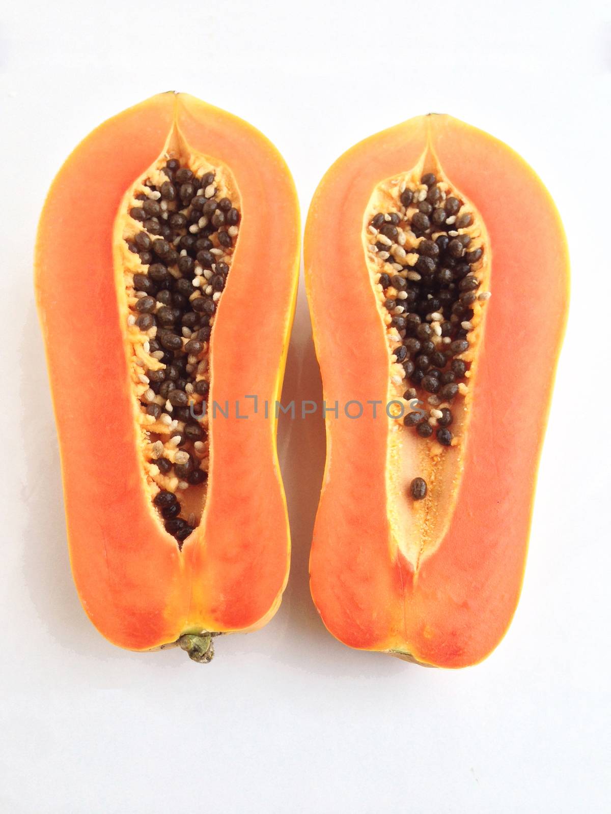 slices of sweet papaya on white background